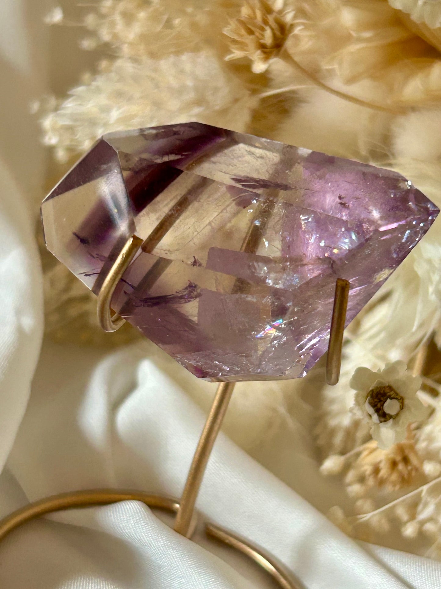 Gem-quality Phantom Amethyst freeform with visible internal layering and rich violet tones, standing upright on a soft background