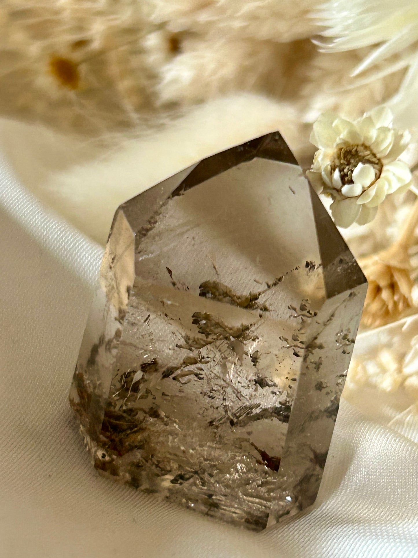 Close-up of Elestial etchings beneath polished surface, showing natural complexity and light reflection