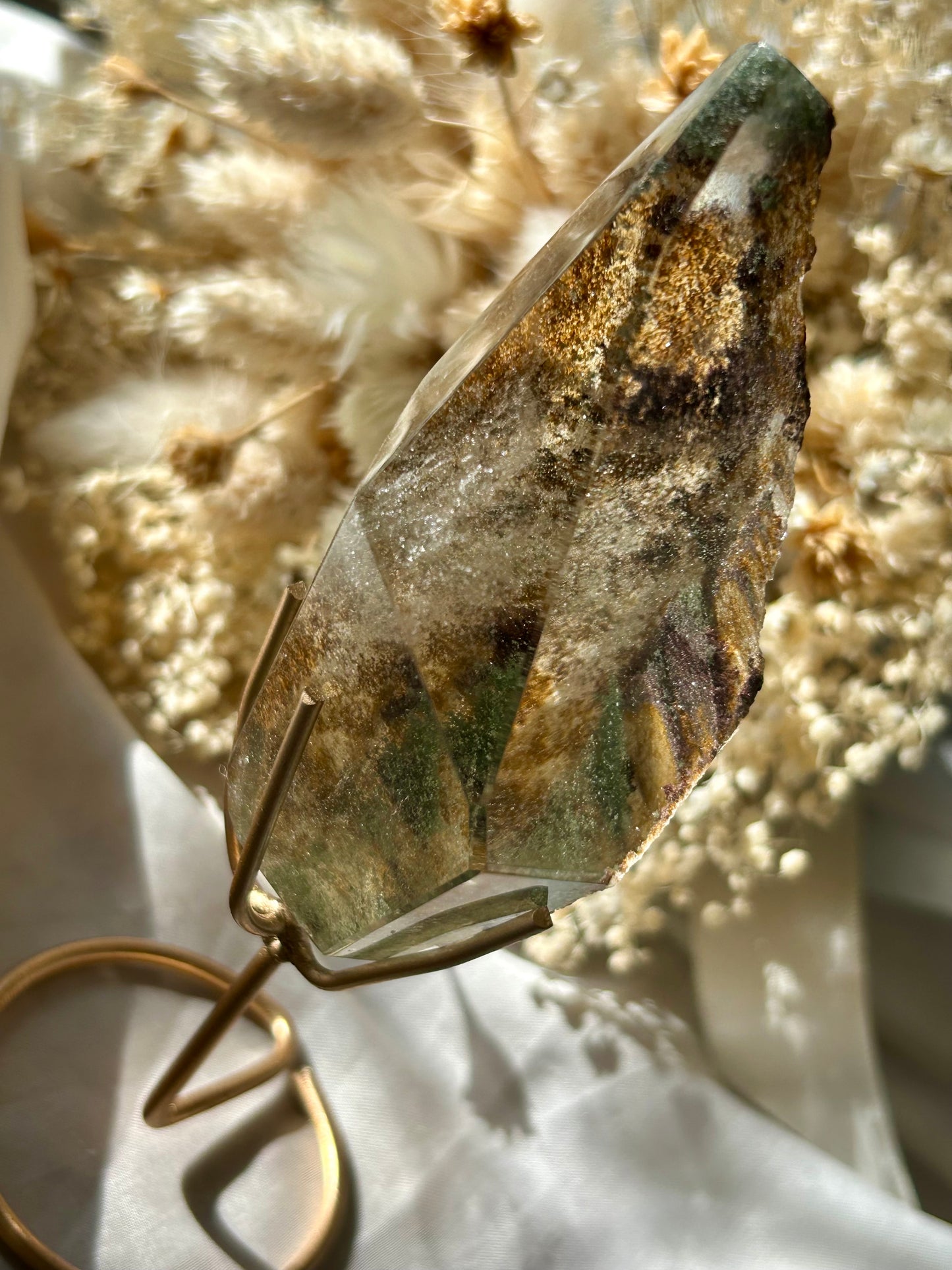 Large semi polished colourful Lodolite on gold display stand