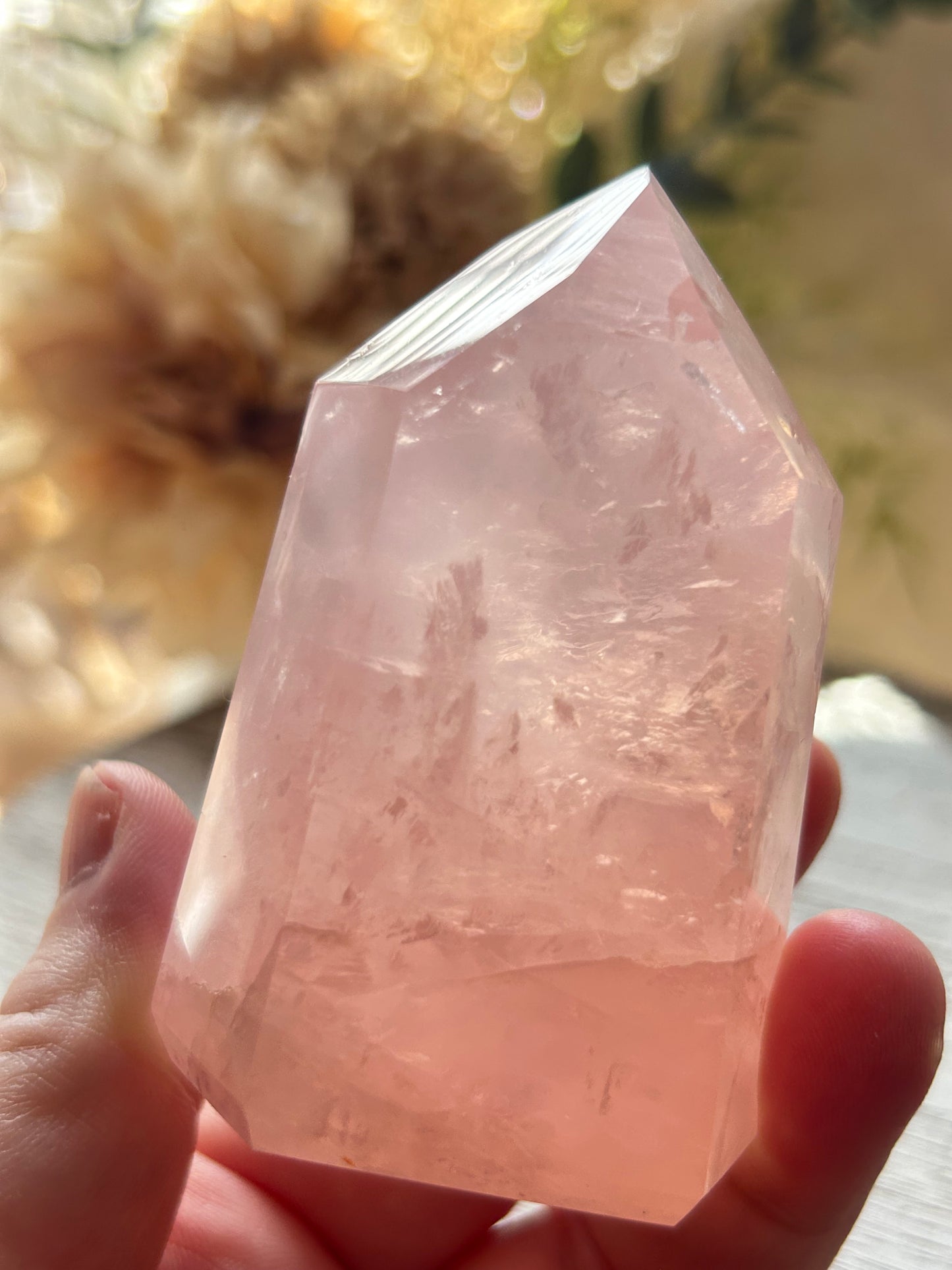 Beautiful polished Rose Quartz with calming blush tones, natural clarity, and glossy crystal finish.