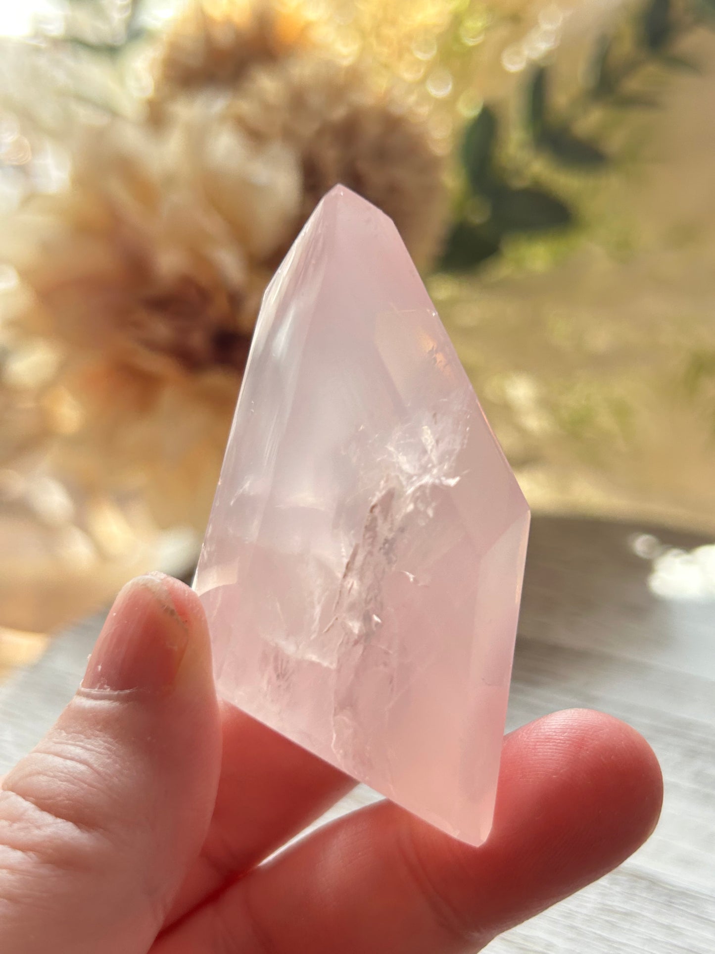 Beautiful polished Rose Quartz with calming blush tones, natural clarity, and glossy crystal finish.