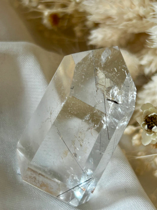 Brazilian AAA rutile quartz crystal showing clarity and radiance in natural lighting
