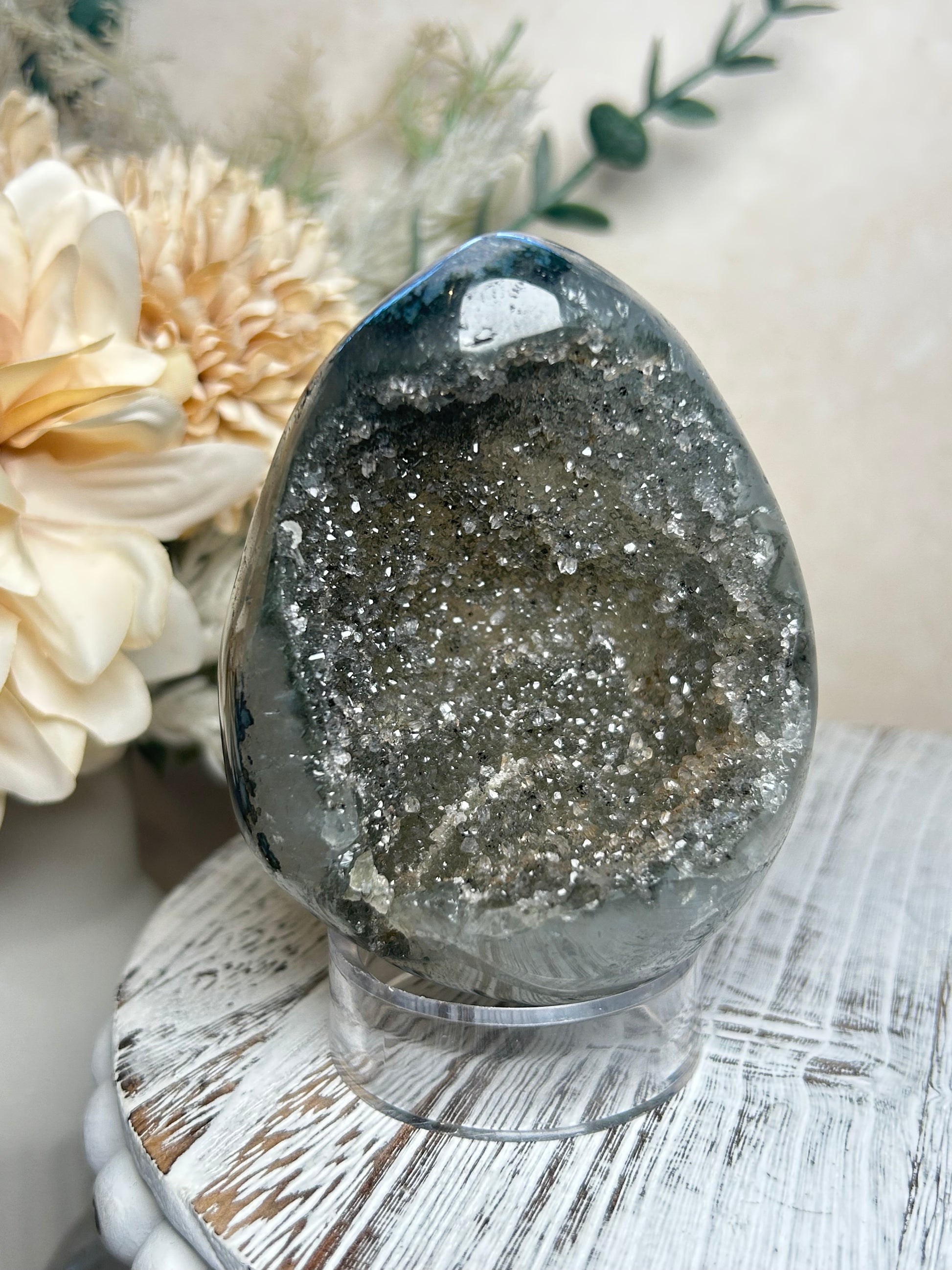 Rainbow Amethyst crystal egg displaying sparkle and layered Agate patterns