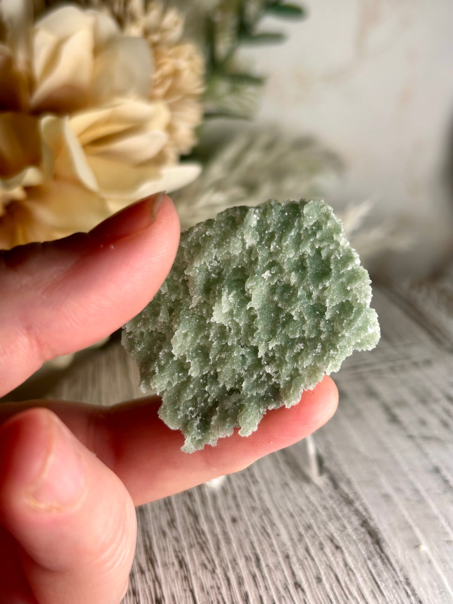 Mini Natural Green Apophyllite crust crystal cluster with sparkling druzy points on display stand from India
