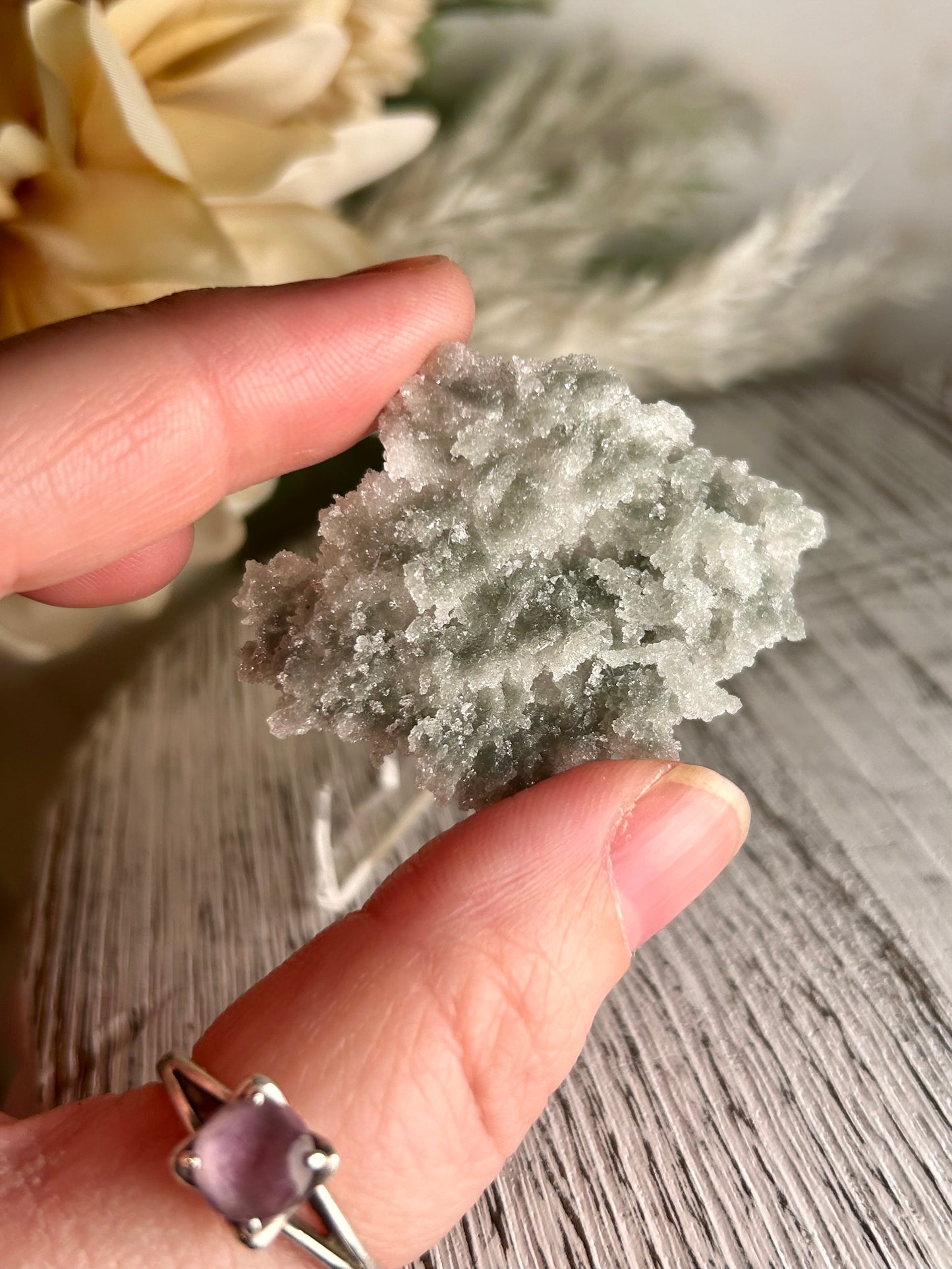 Mini Natural Green Apophyllite crust crystal cluster with sparkling druzy points on display stand from India