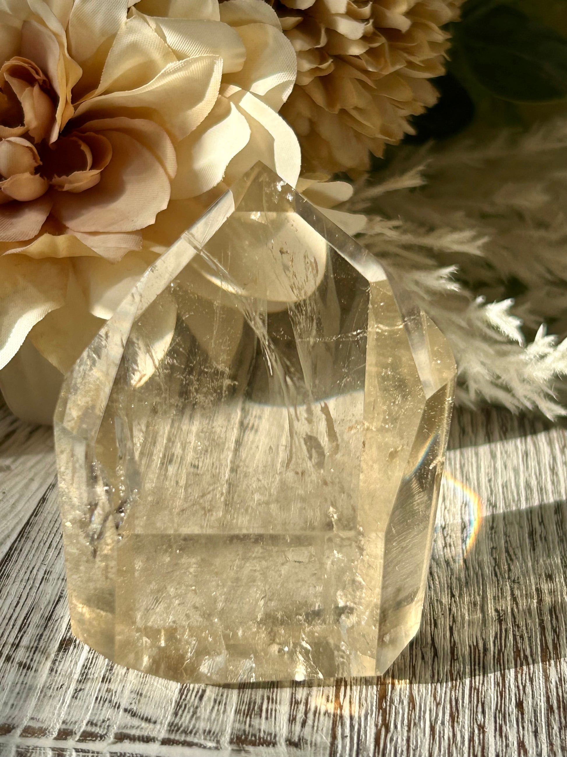 Polished Citrine tower displaying warm honey-gold tones, natural crystal inclusions, and beautiful clarity.