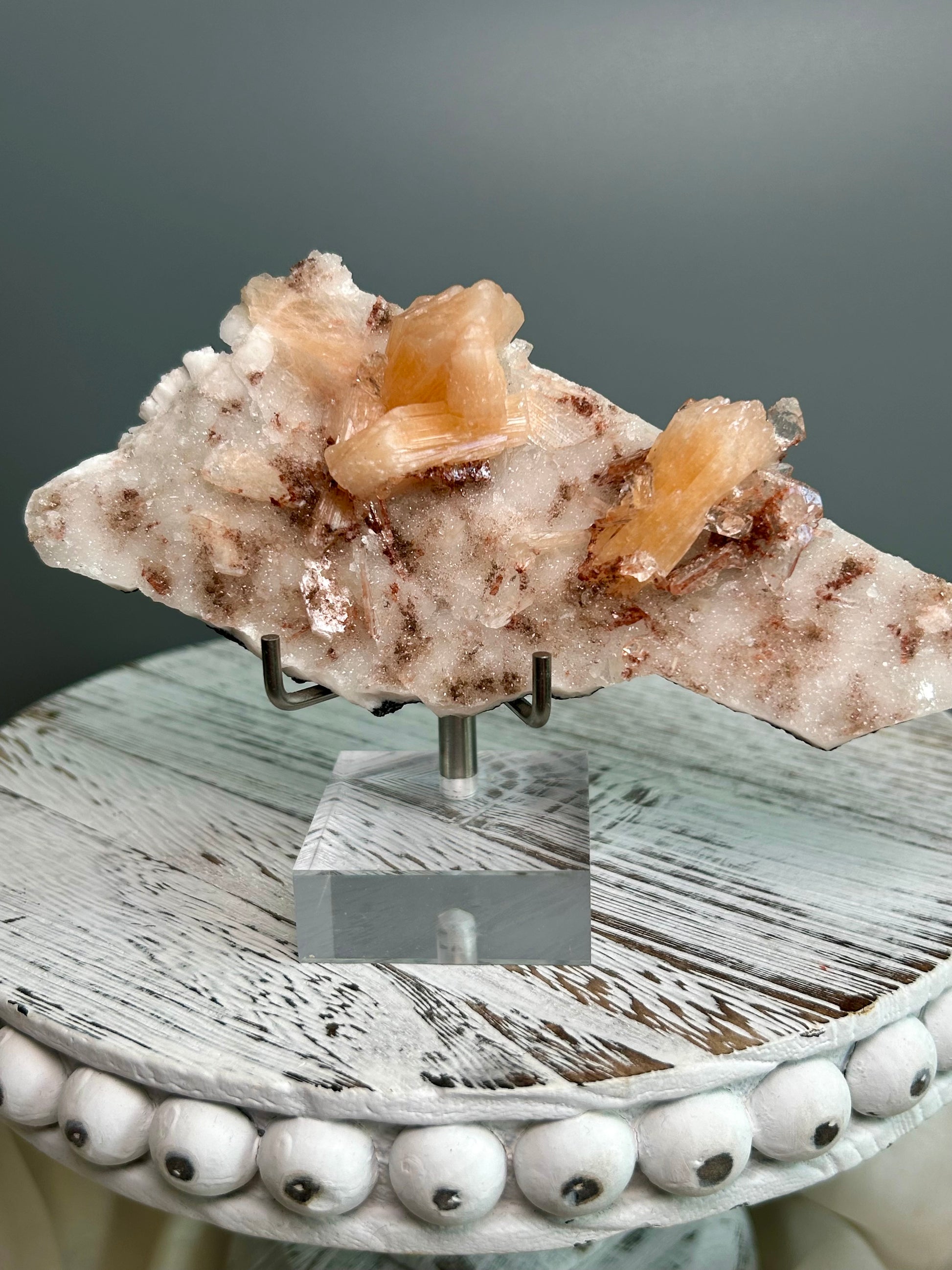 Apophyllite and Stilbite mineral specimen on matrix from Sangamner India, peach stilbite crystals and clear apophyllite cluster on acrylic stand.
