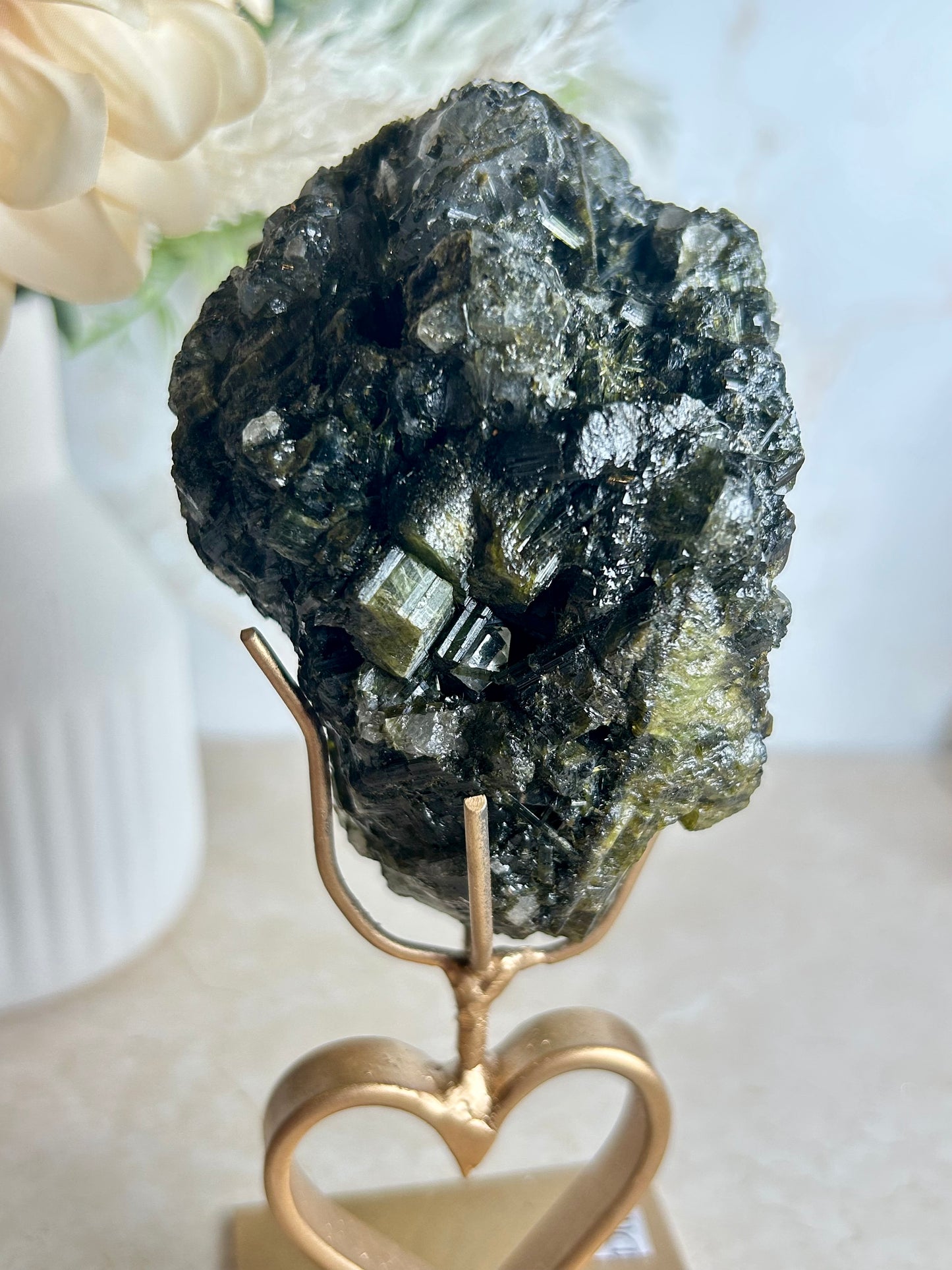 Natural tourmaline and epidote crystal cluster specimen on gold display stand with deep green epidote crystals.