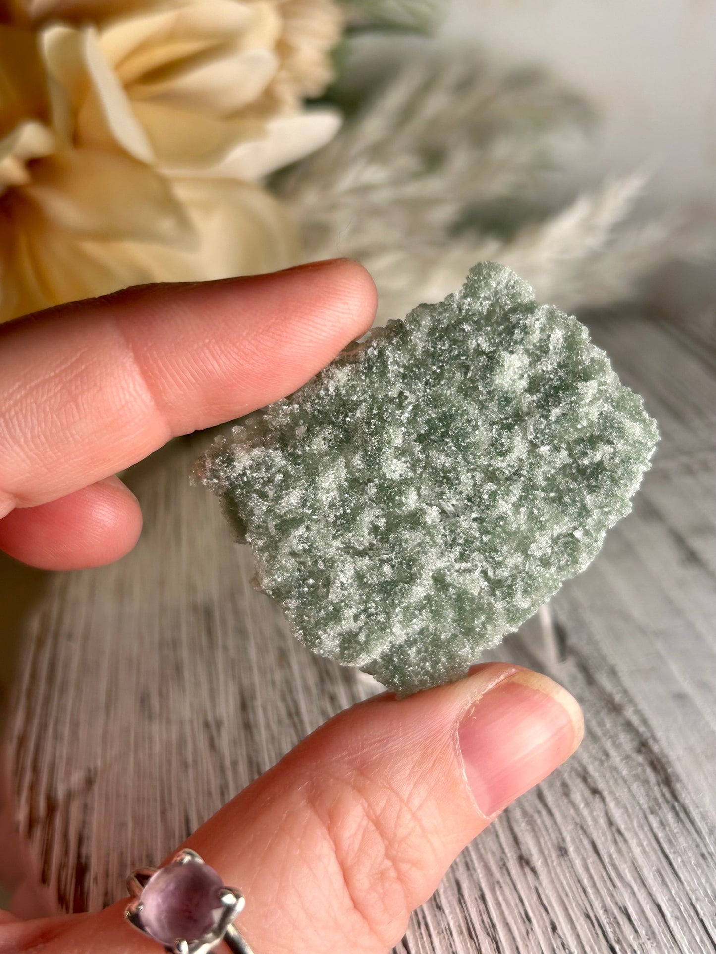 Mini Natural Green Apophyllite crust crystal cluster with sparkling druzy points on display stand from India