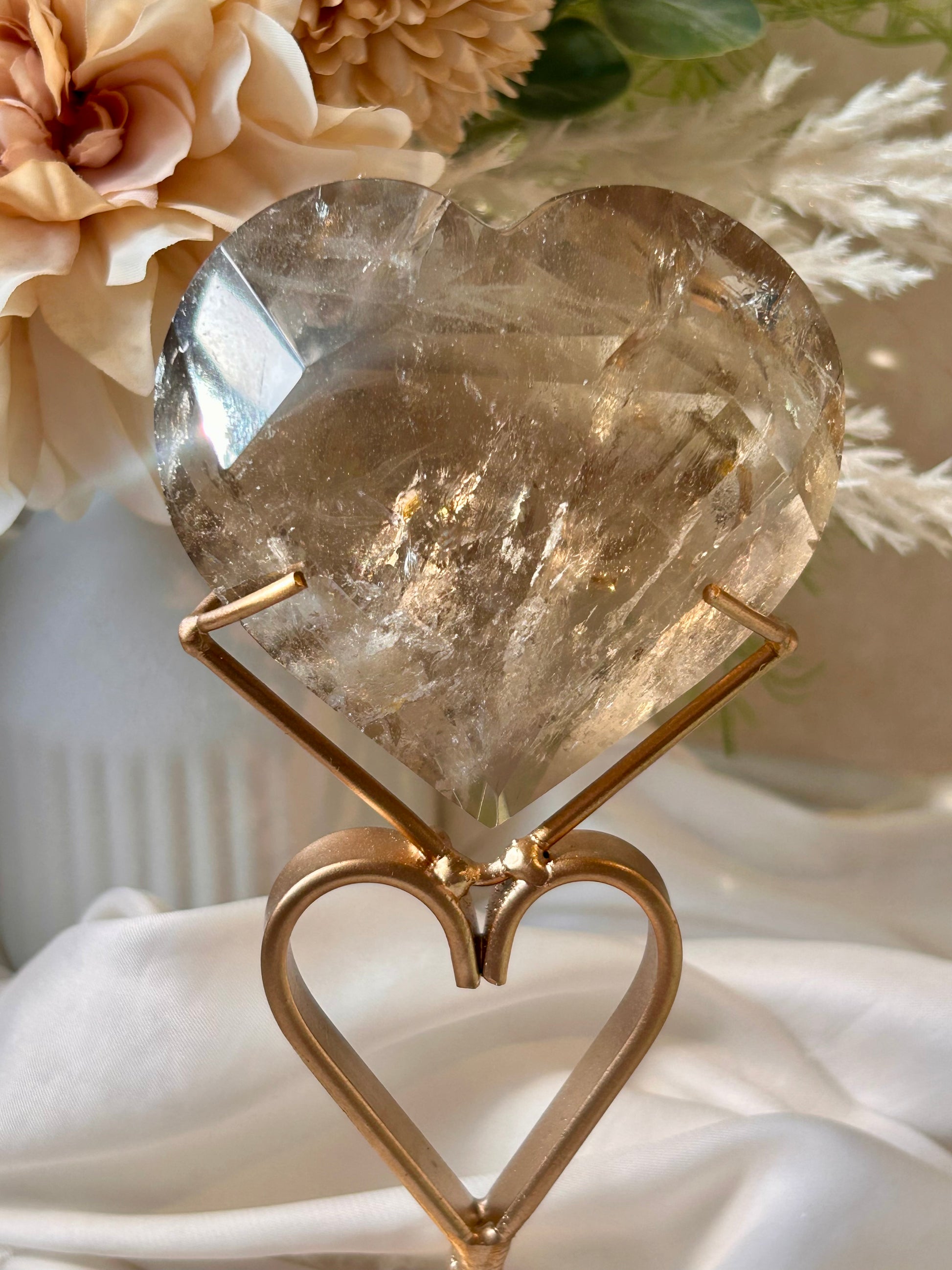 Faceted Smoky Quartz heart with natural smoky tones and custom crystal display stand.