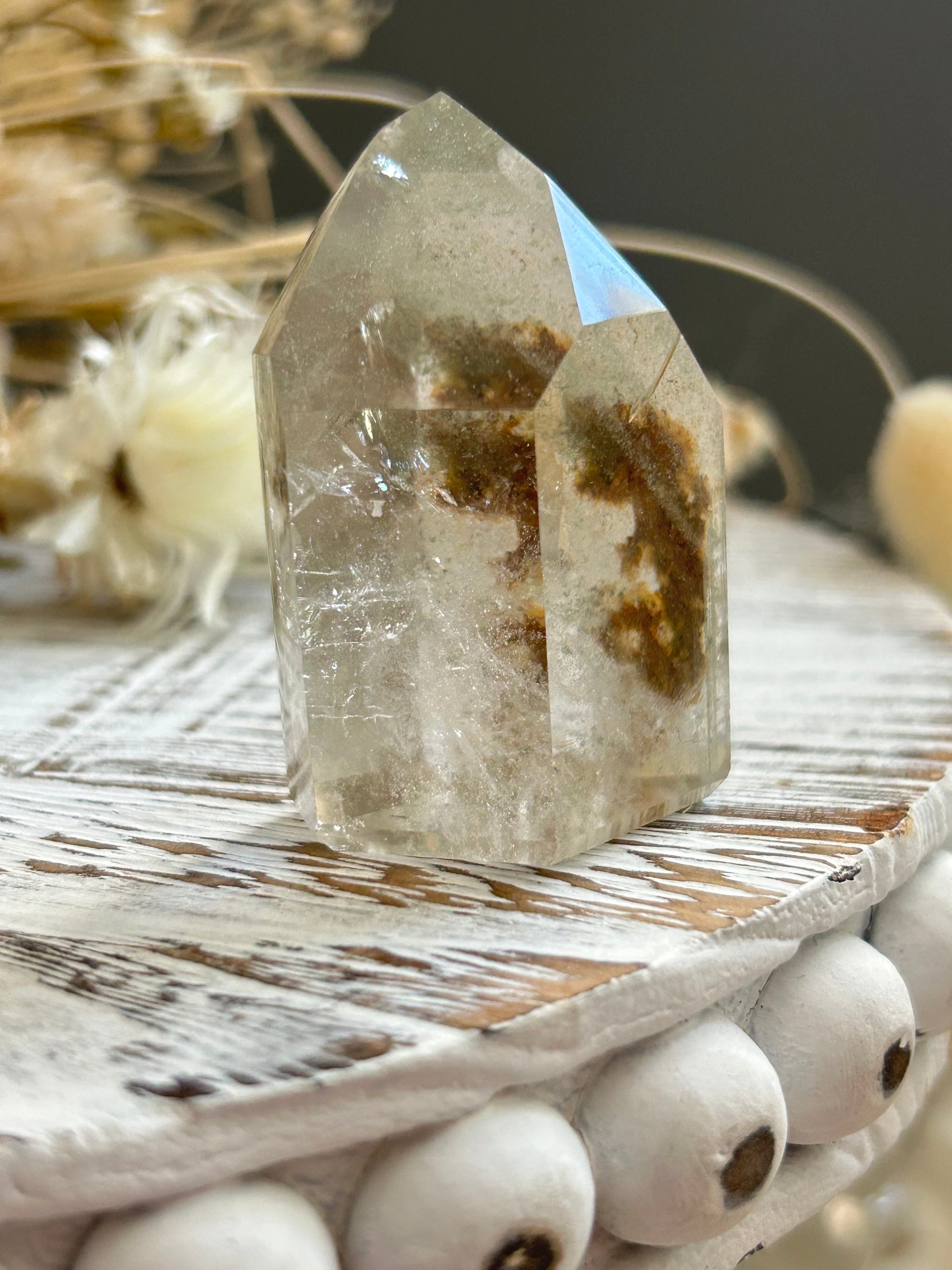 Chlorite phantom quartz point showing green chlorite inclusions and layered phantom growth within clear quartz.