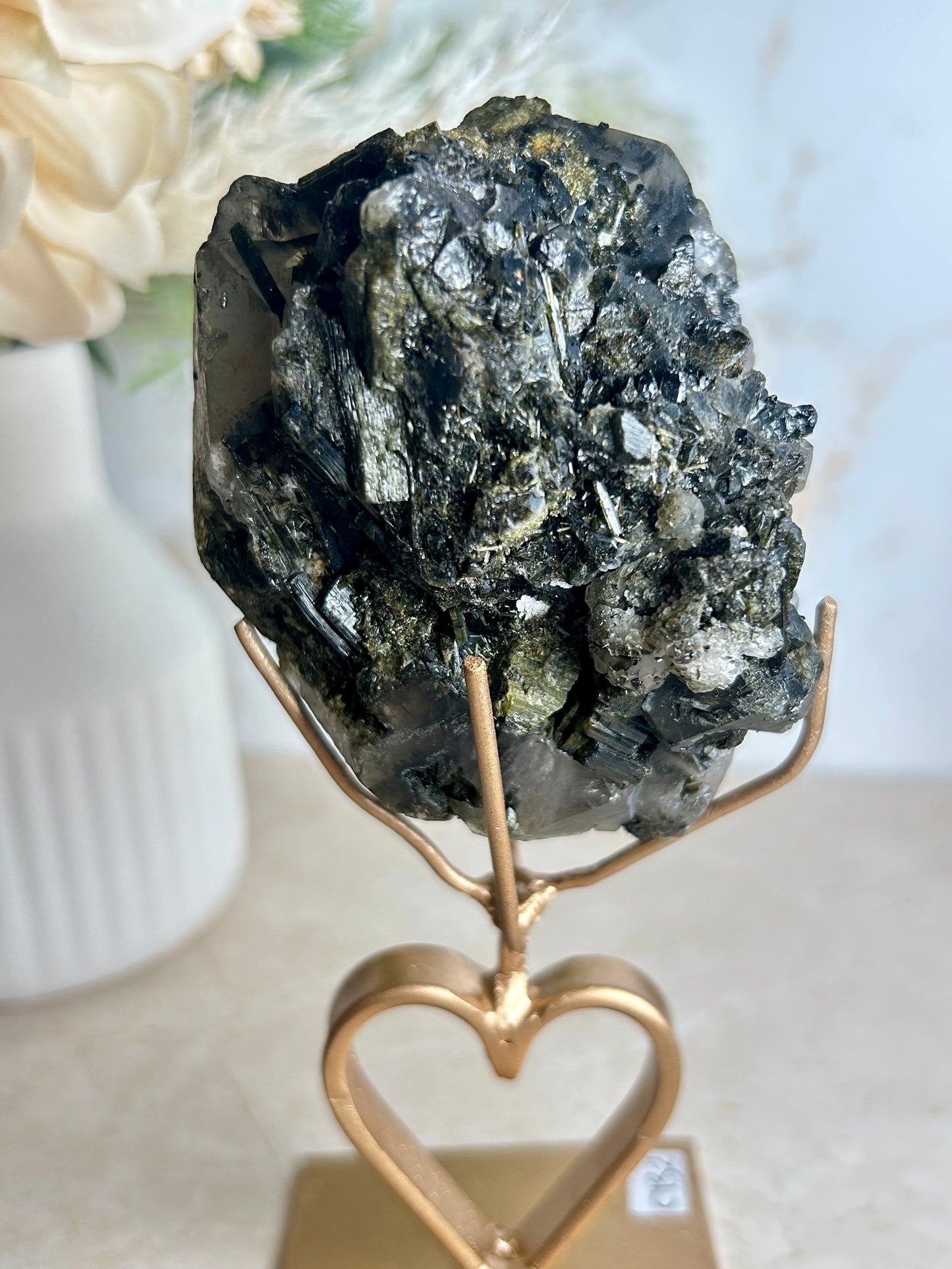 Natural tourmaline and epidote crystal cluster specimen on gold display stand with deep green epidote crystals.