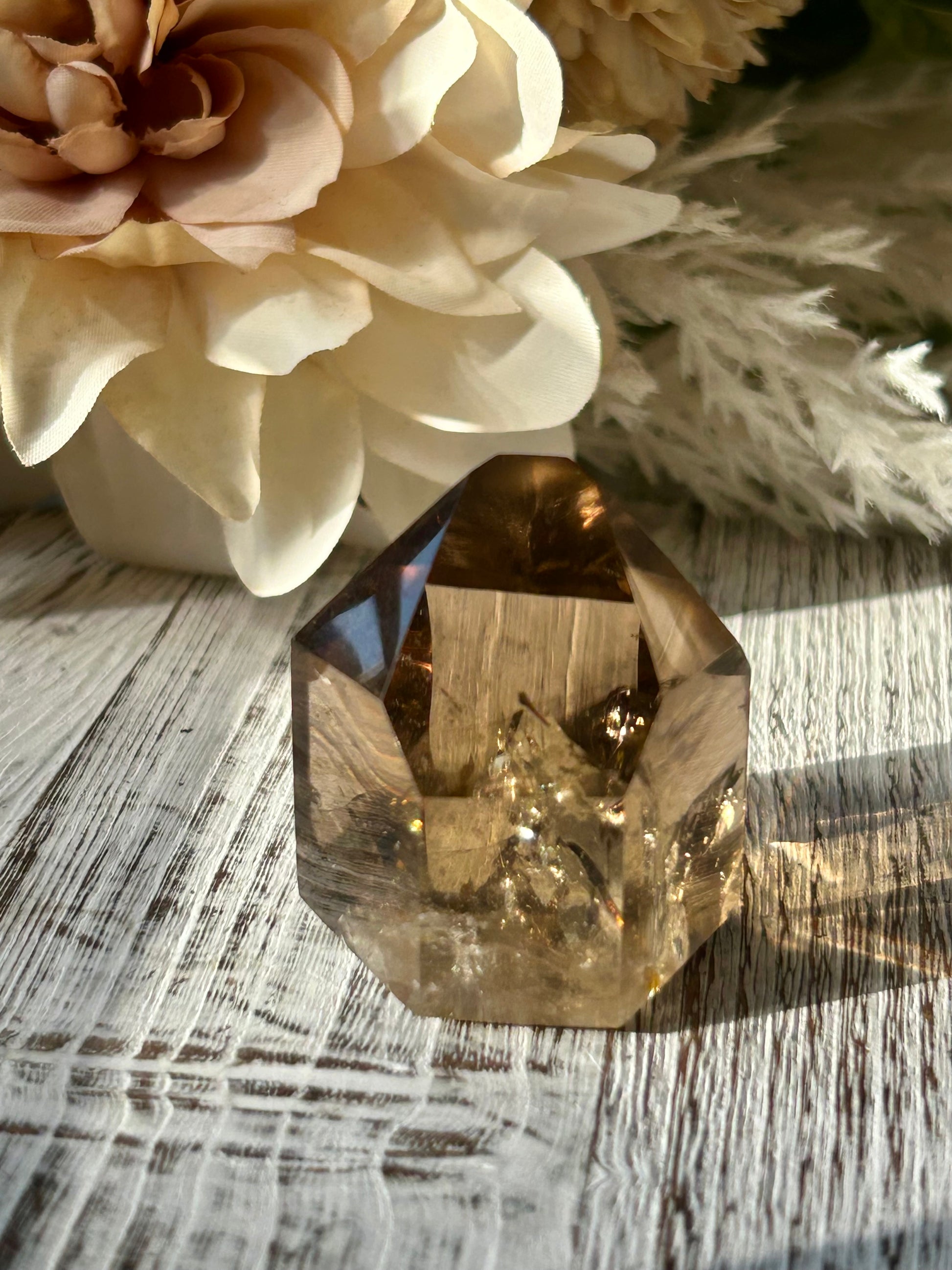 Polished Citrine tower displaying warm honey-gold tones, natural crystal inclusions, and beautiful clarity.