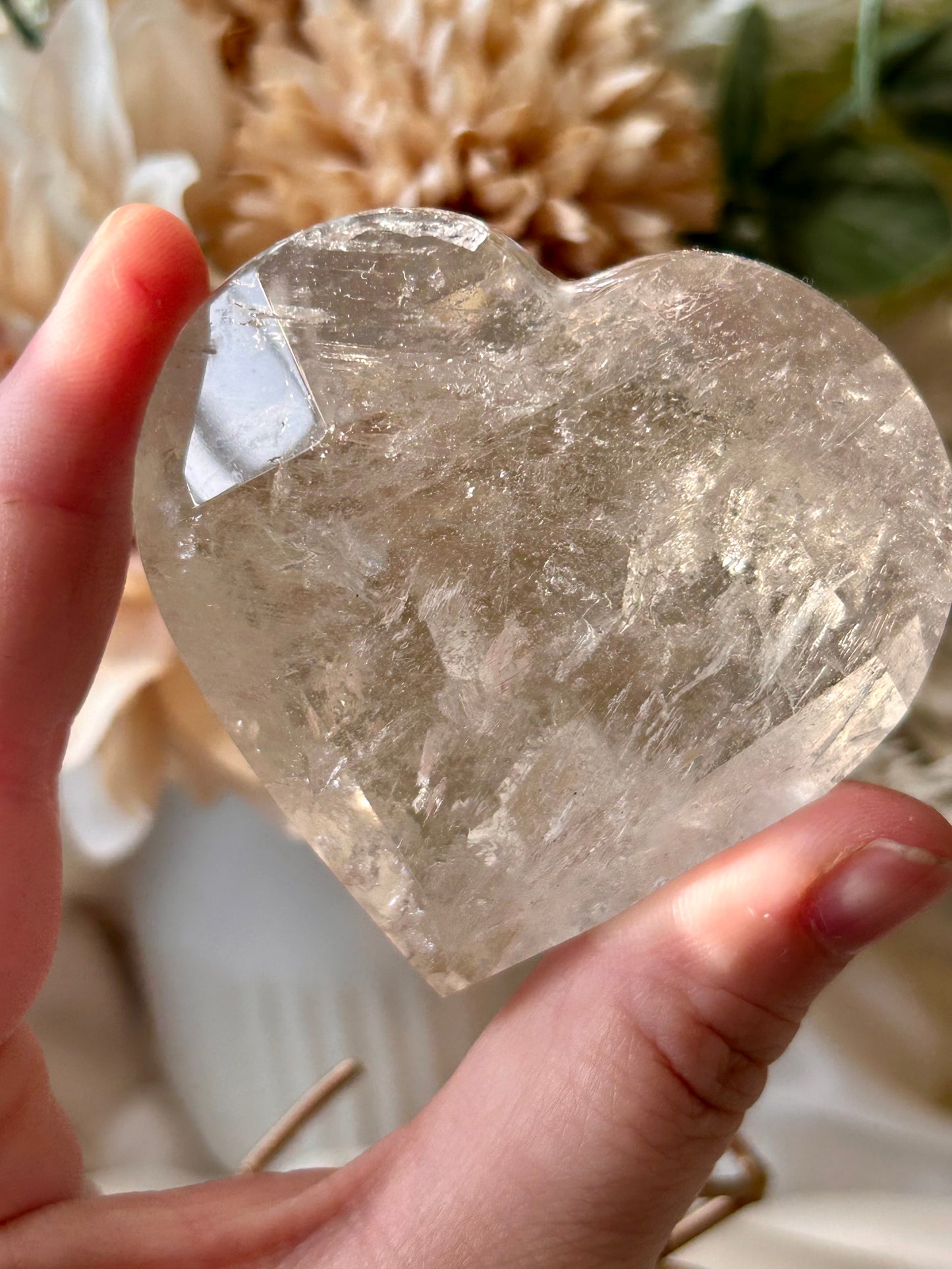 Faceted Smoky Quartz heart with natural smoky tones and custom crystal display stand.