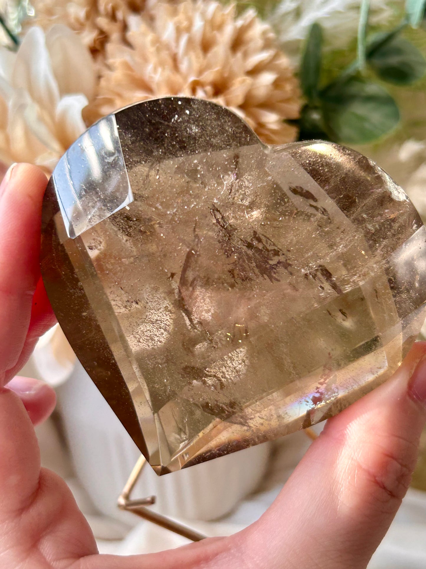 Faceted Smoky Quartz heart with natural smoky tones and custom crystal display stand.