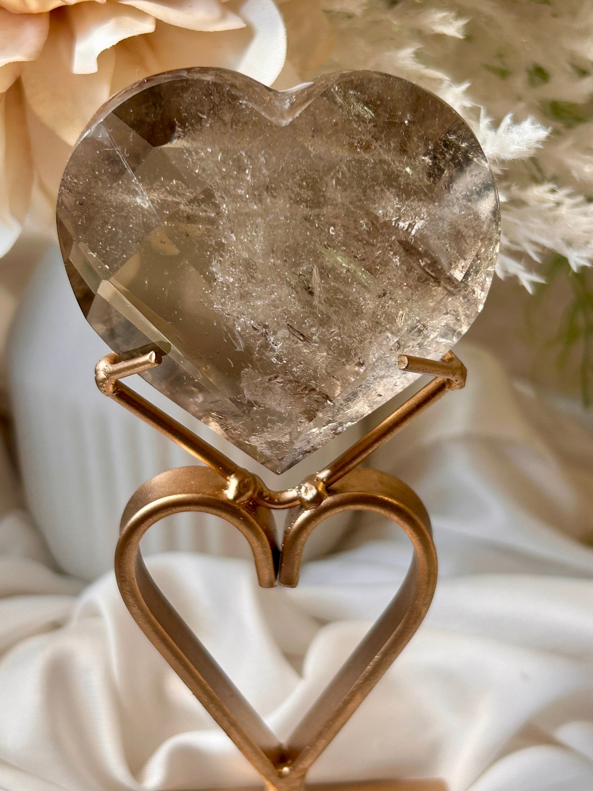 Faceted Smoky Quartz heart with natural smoky tones and custom crystal display stand.