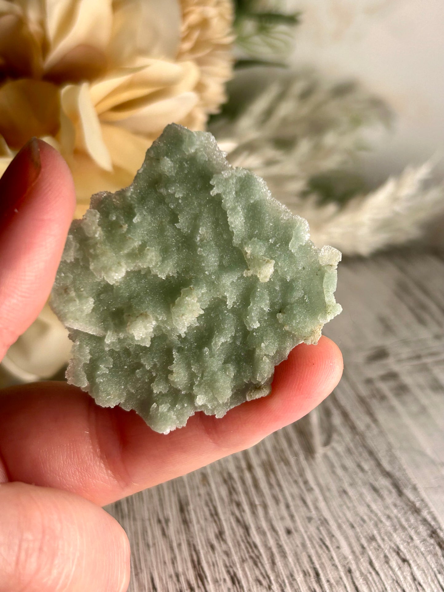 Mini Natural Green Apophyllite crust crystal cluster with sparkling druzy points on display stand from India