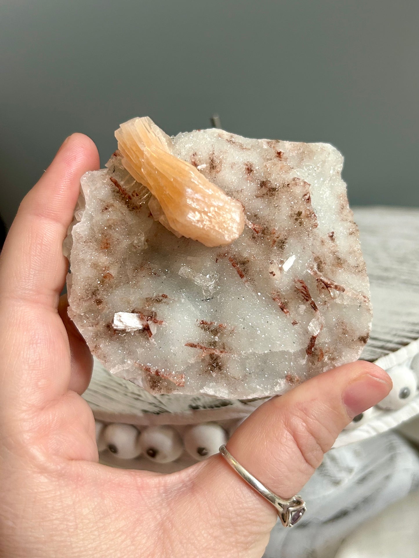 Clear apophyllite stalactite cluster on display, sparkling crystal formation