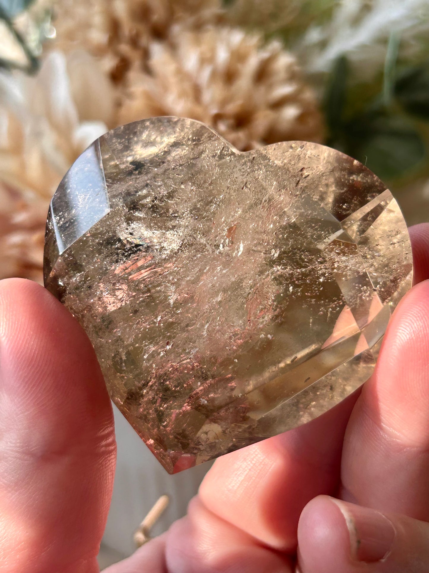 Faceted Smoky Quartz heart with natural smoky tones and custom crystal display stand.