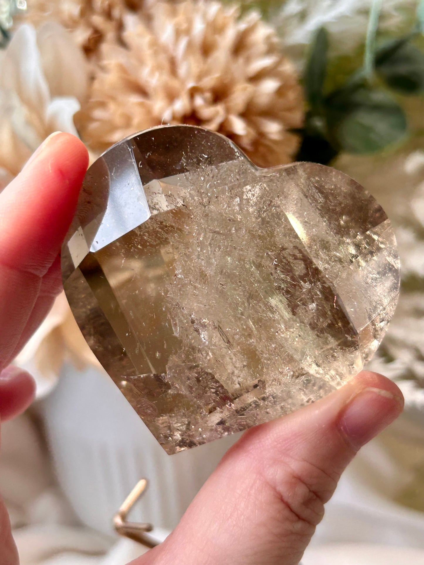 Faceted Smoky Quartz heart with natural smoky tones and custom crystal display stand.