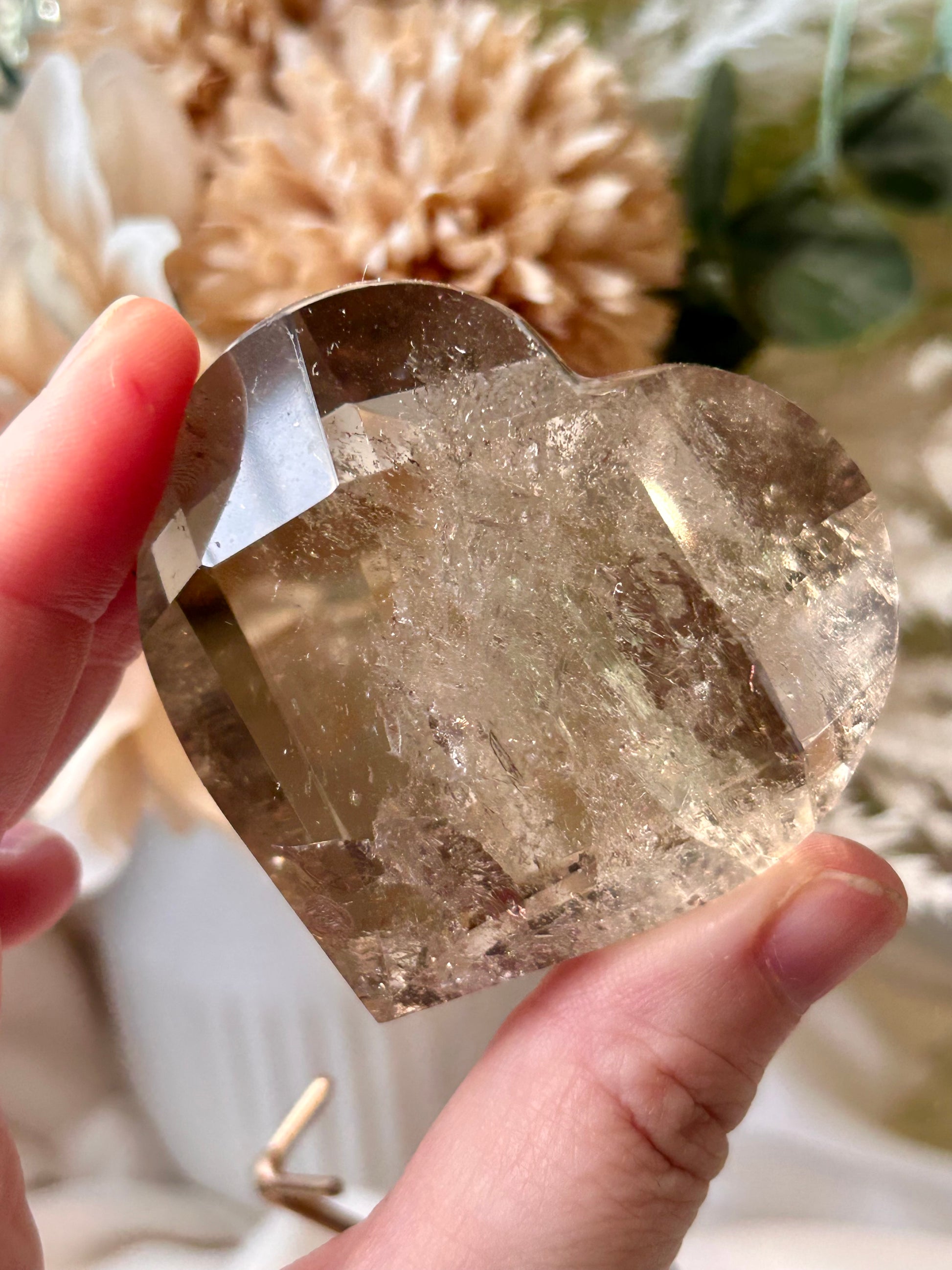 Faceted Smoky Quartz heart with natural smoky tones and custom crystal display stand.