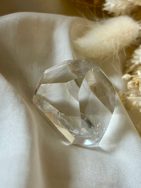 Brazilian AAA rutile quartz crystal showing clarity and radiance in natural lighting