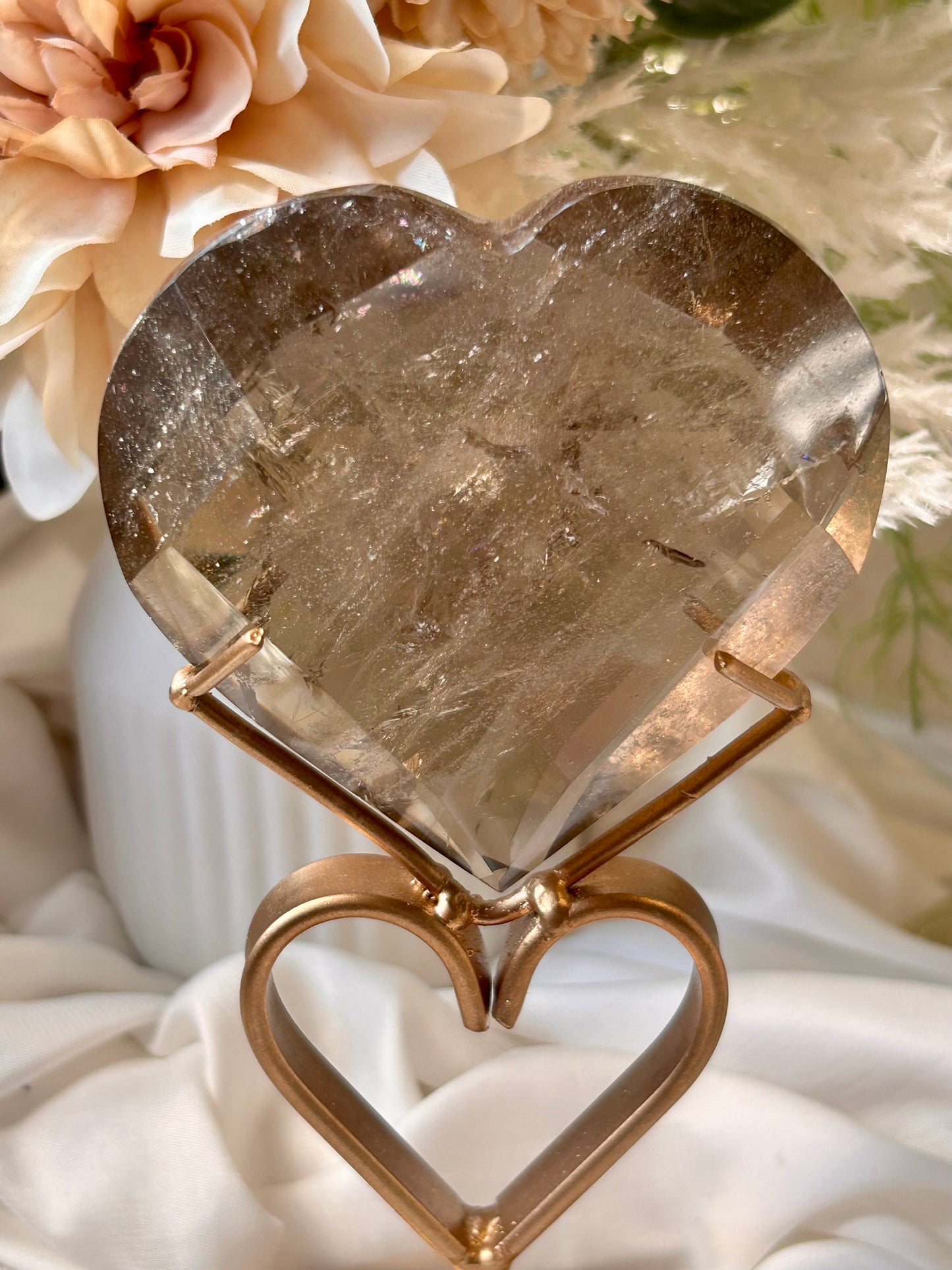 Faceted Smoky Quartz heart with natural smoky tones and custom crystal display stand.
