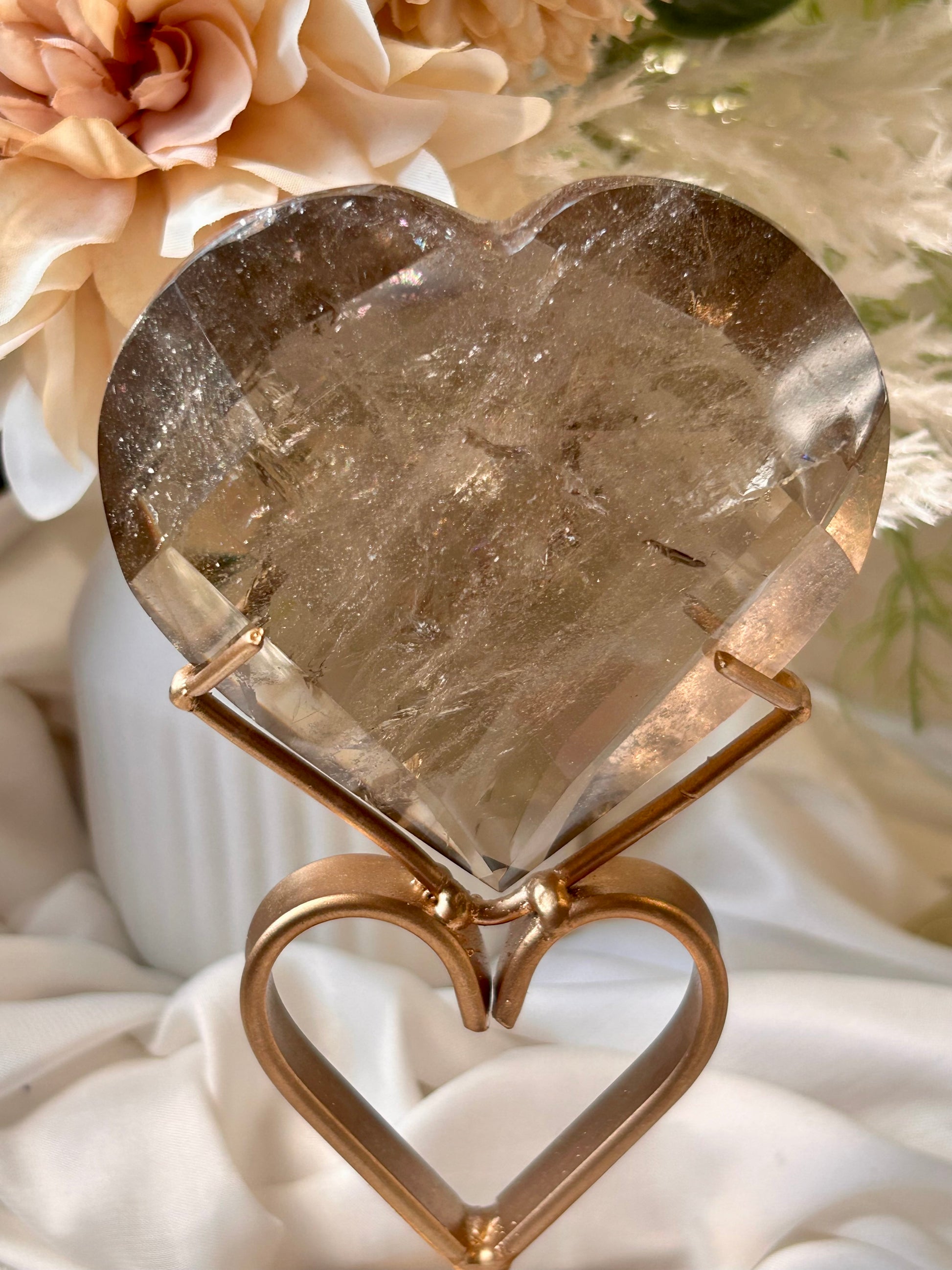 Faceted Smoky Quartz heart with natural smoky tones and custom crystal display stand.