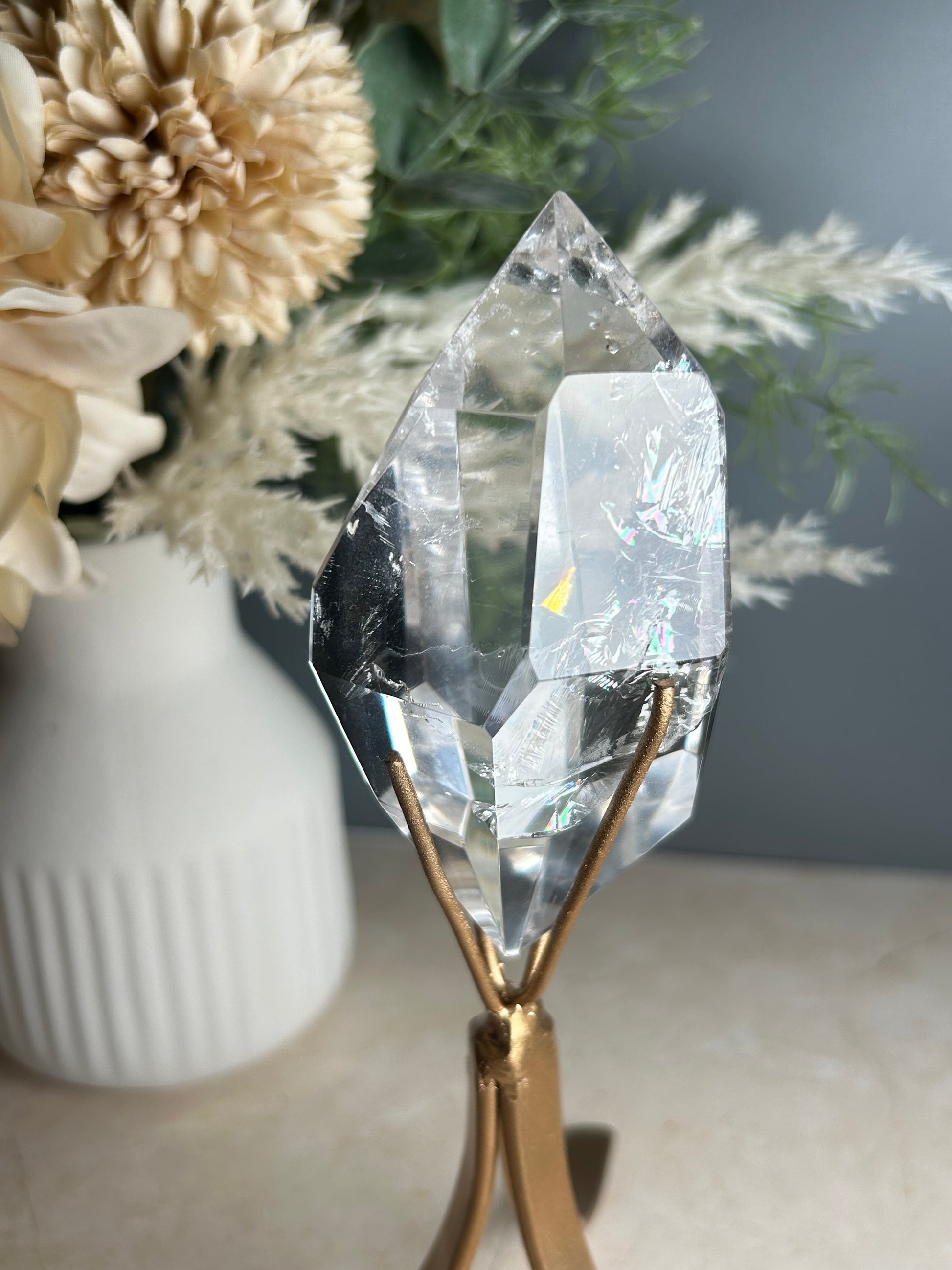 high grade polished clear quartz freeform crystal on gold display stand natural quartz specimen