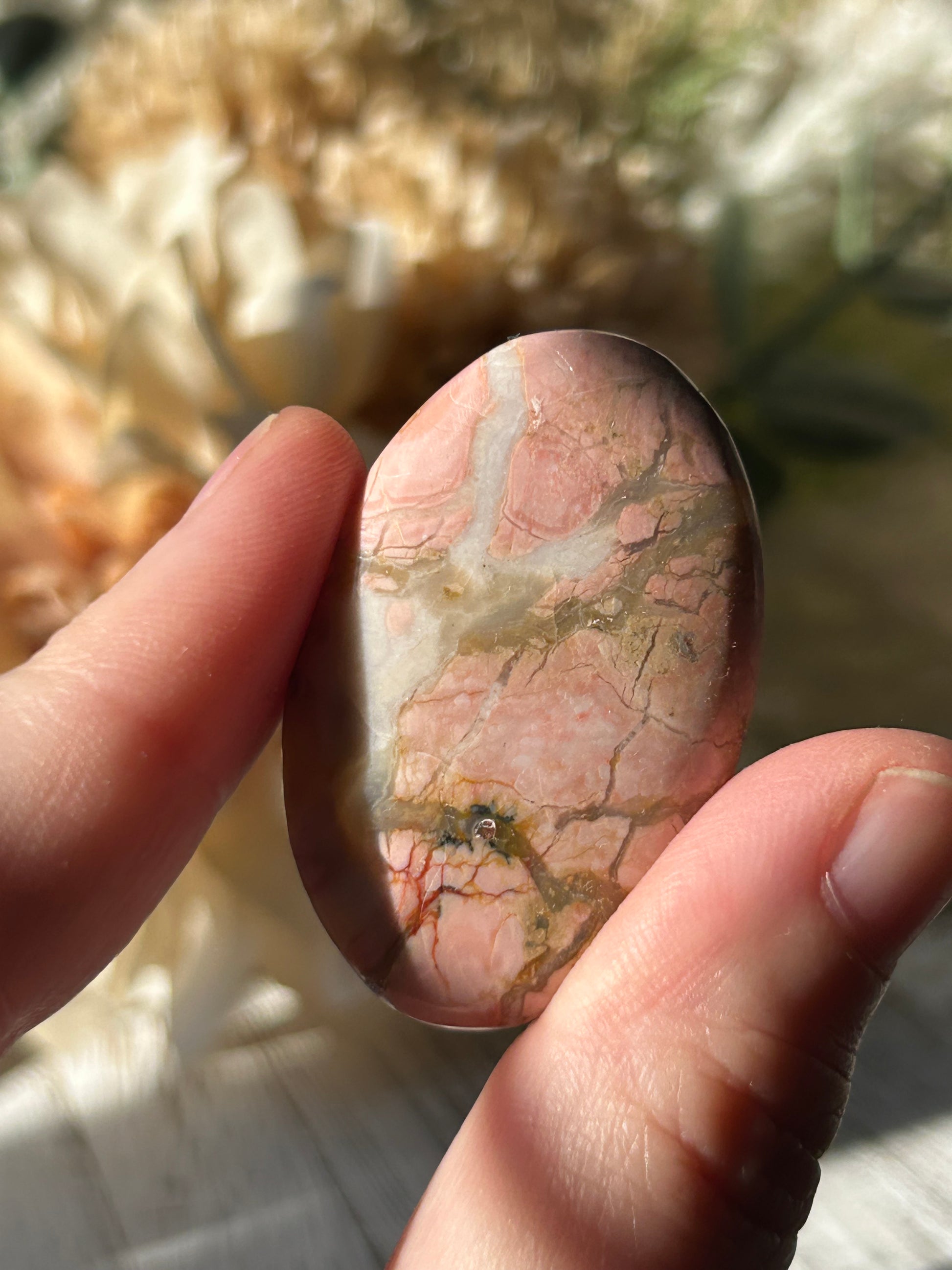 Pink Australian Opal palm stone with soft blush tones, polished finish, and natural patterns.