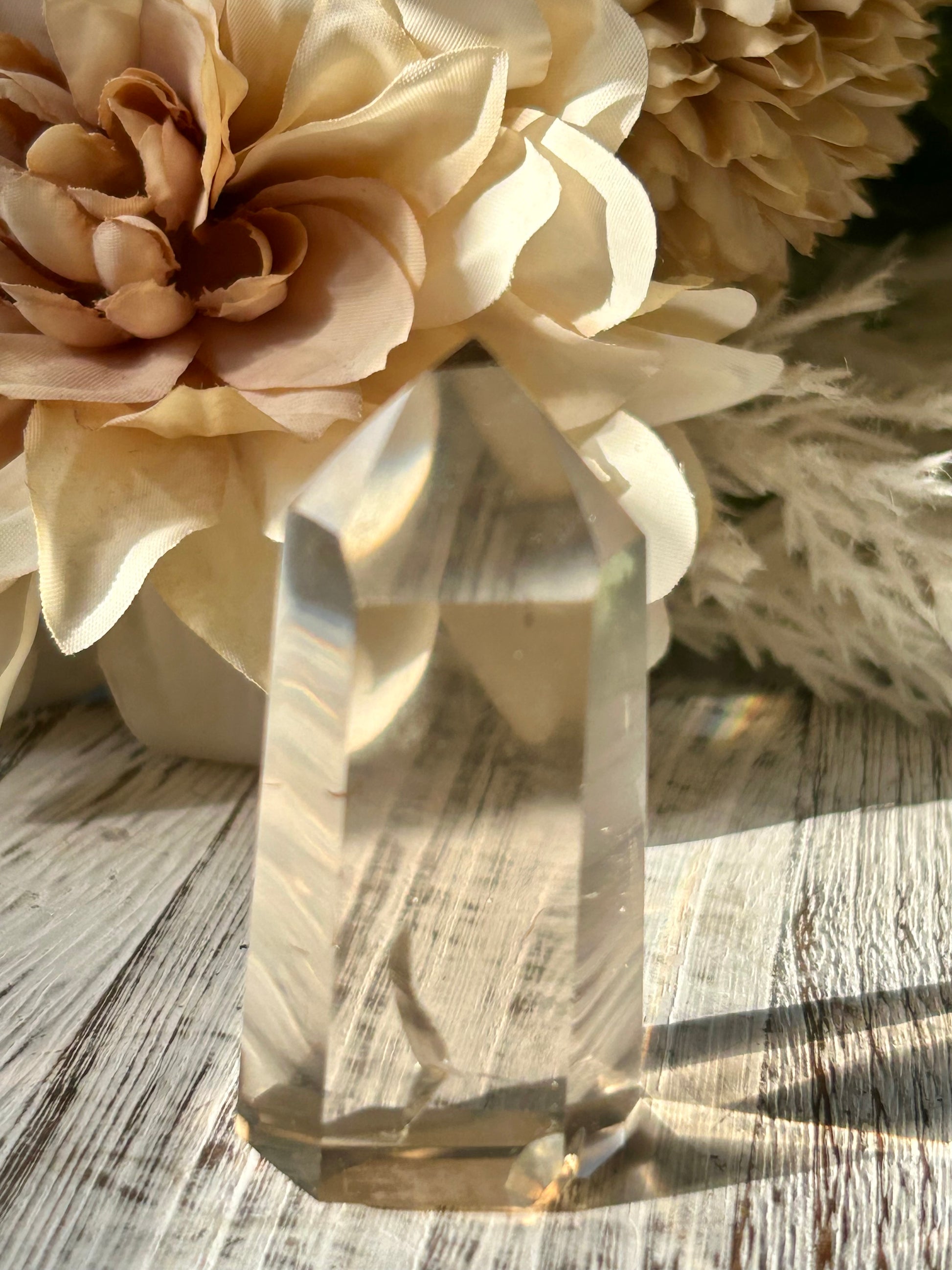 Polished Citrine tower displaying warm honey-gold tones, natural crystal inclusions, and beautiful clarity.