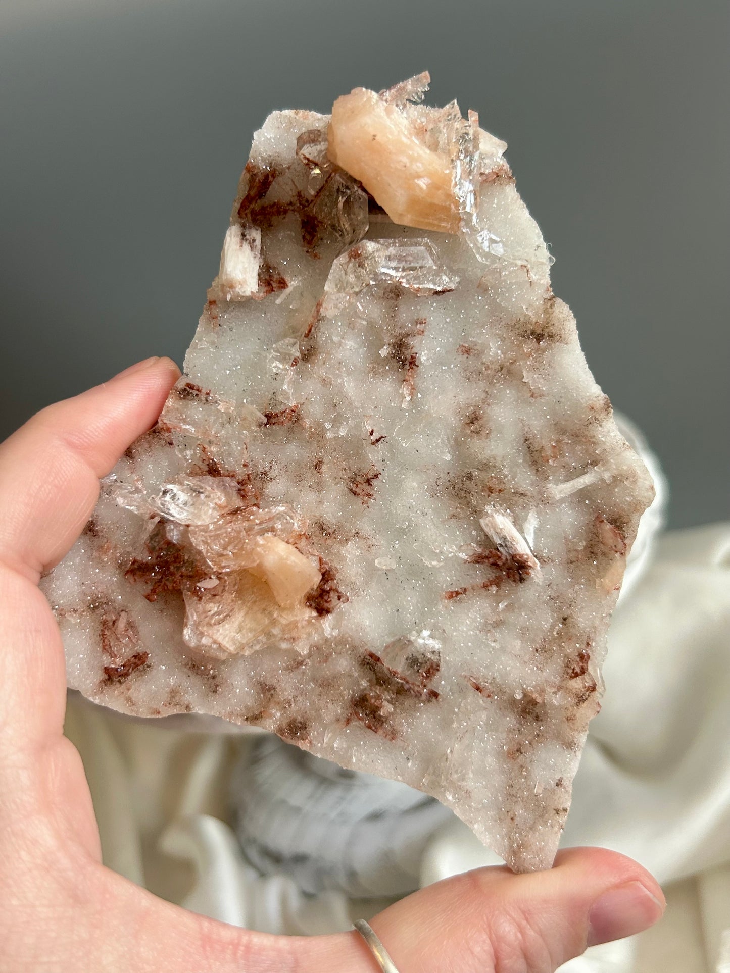 Clear apophyllite stalactite cluster on display, sparkling crystal formation