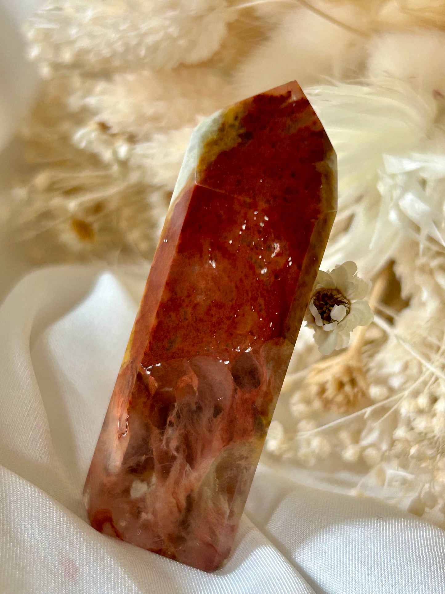 Amphibole Quartz crystal with soft cloud-like inclusions and gentle light play, standing upright on a neutral background
