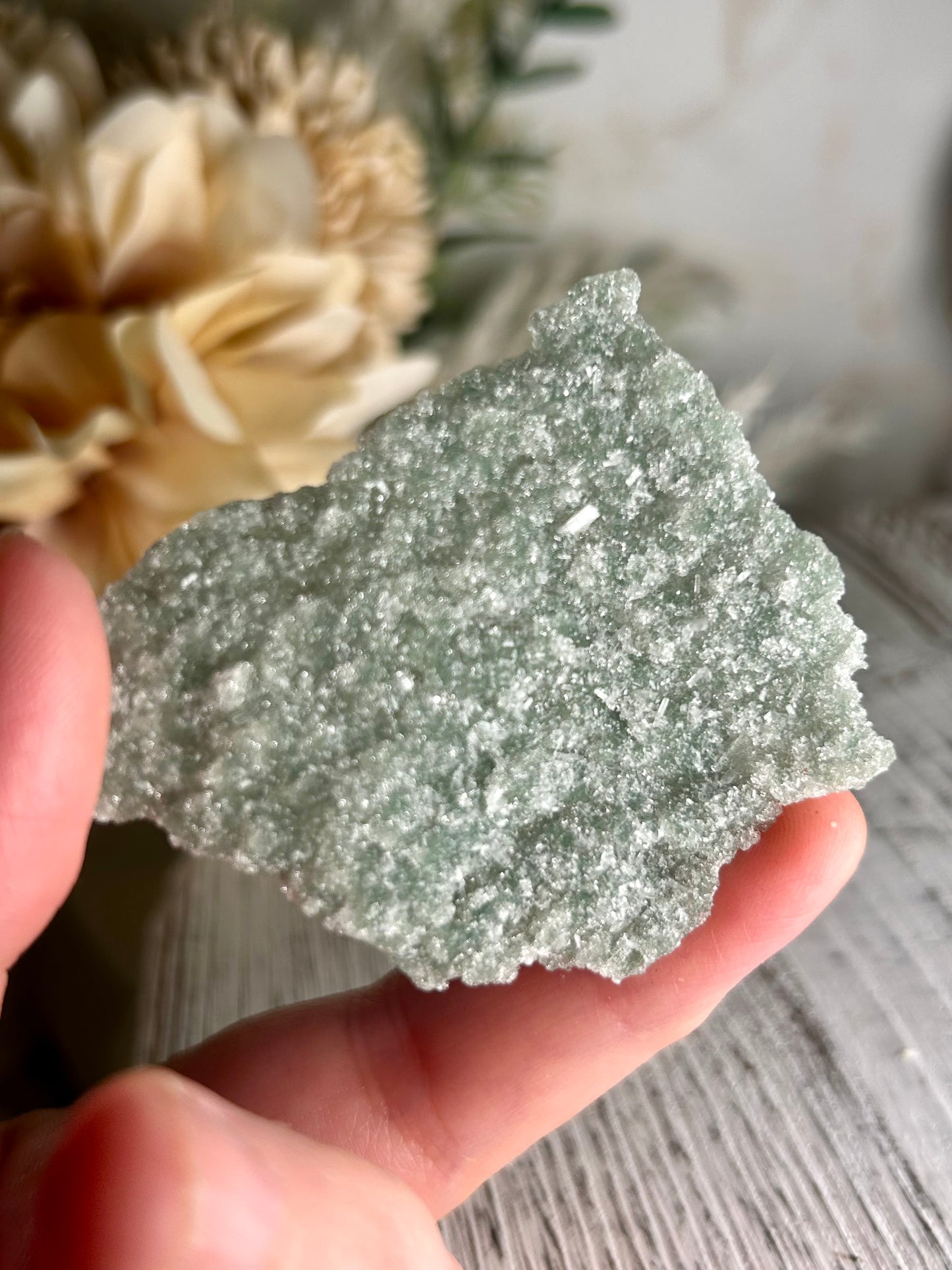 Mini Natural Green Apophyllite crust crystal cluster with sparkling druzy points on display stand from India