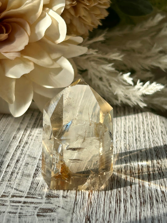 Polished Citrine tower displaying warm honey-gold tones, natural crystal inclusions, and beautiful clarity.