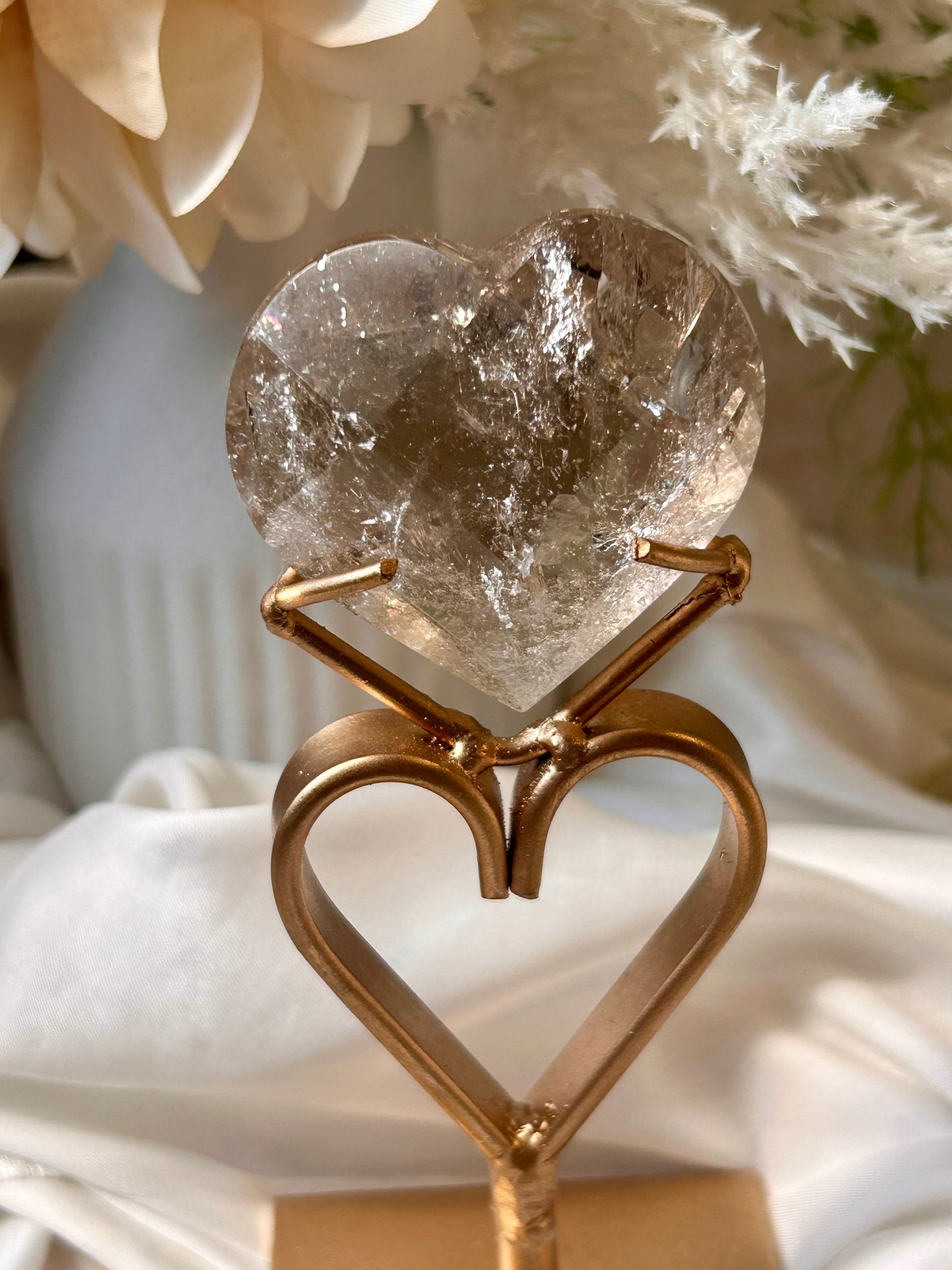 Faceted Smoky Quartz heart with natural smoky tones and custom crystal display stand.