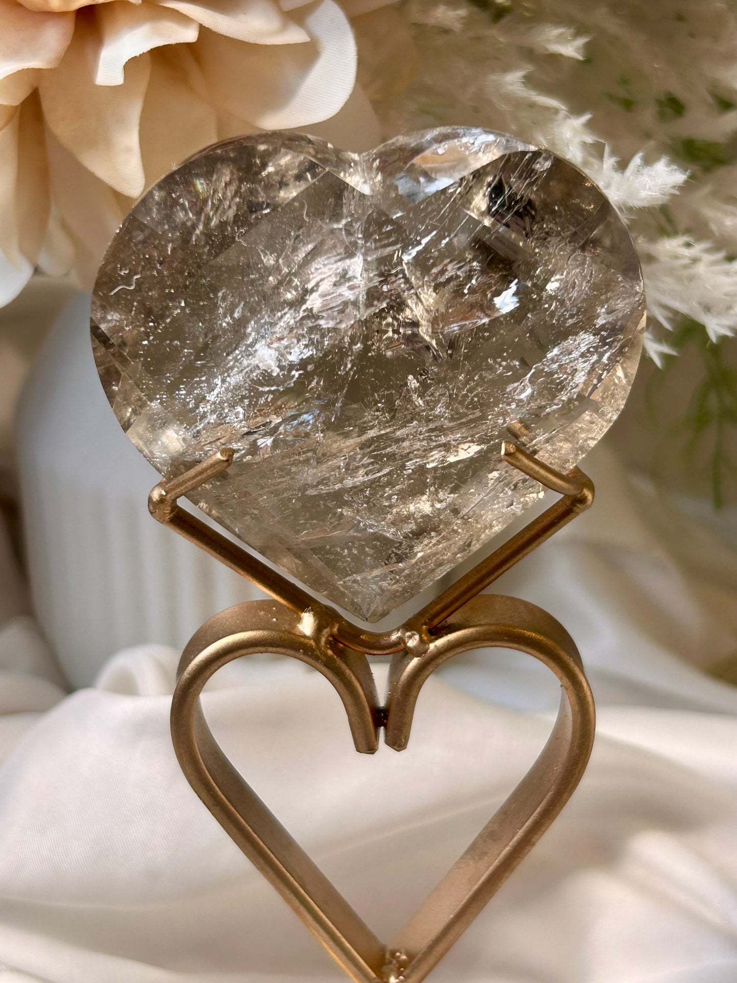 Faceted Smoky Quartz heart with natural smoky tones and custom crystal display stand.