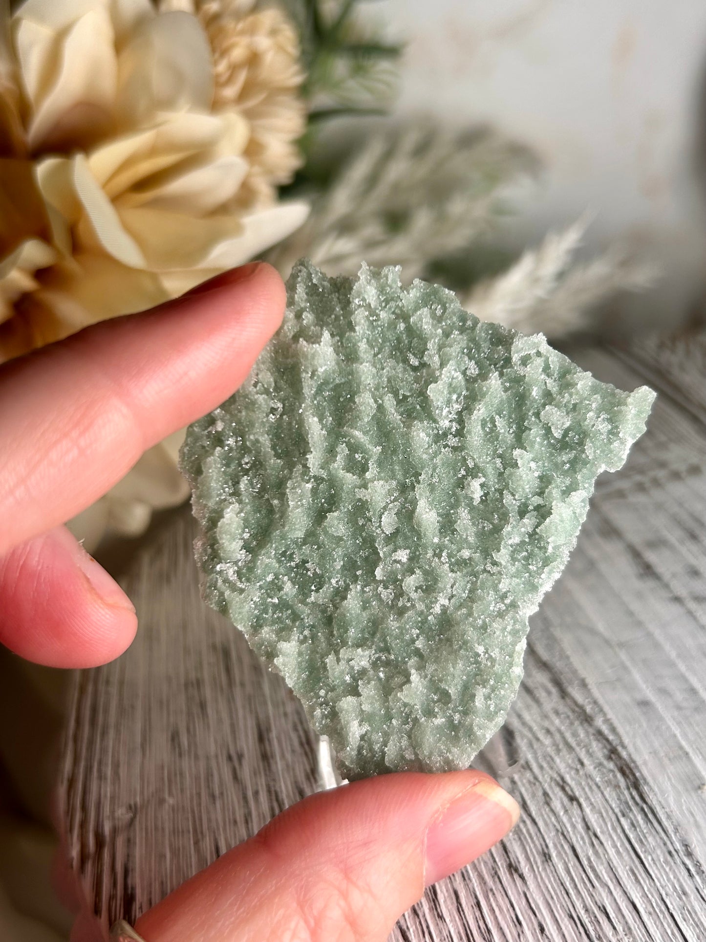 Mini Natural Green Apophyllite crust crystal cluster with sparkling druzy points on display stand from India