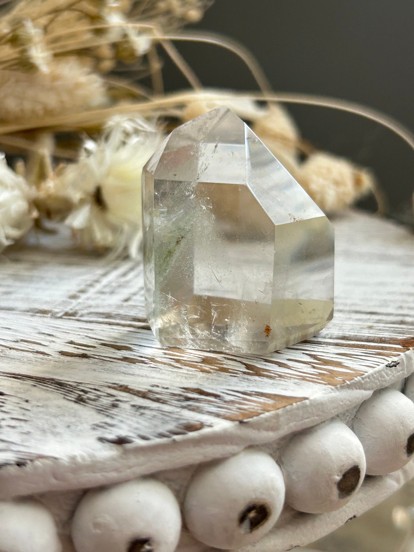 Chlorite phantom quartz point showing green chlorite inclusions and layered phantom growth within clear quartz.