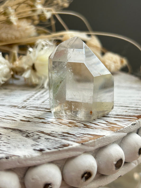 Chlorite phantom quartz point showing green chlorite inclusions and layered phantom growth within clear quartz.