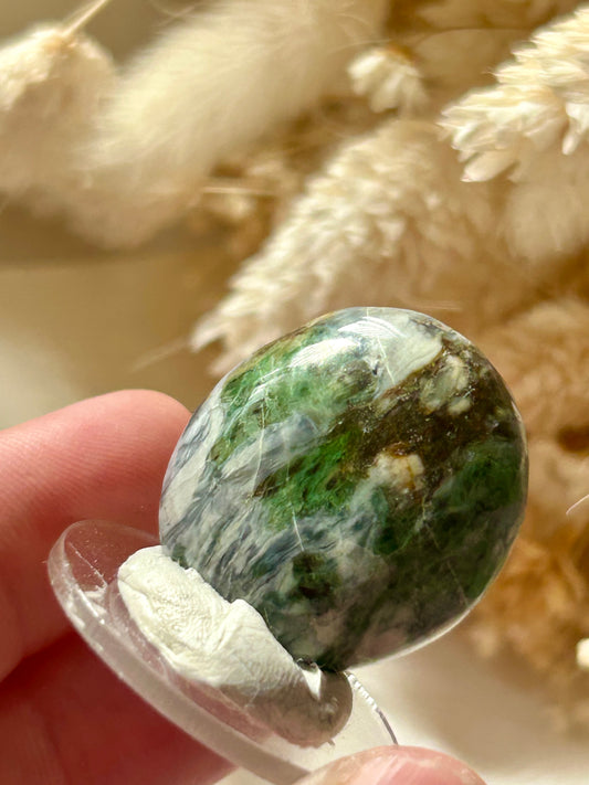 Polished green Smaragdite cabochon from France with visible actinolite inclusions – jewellery safe stone
