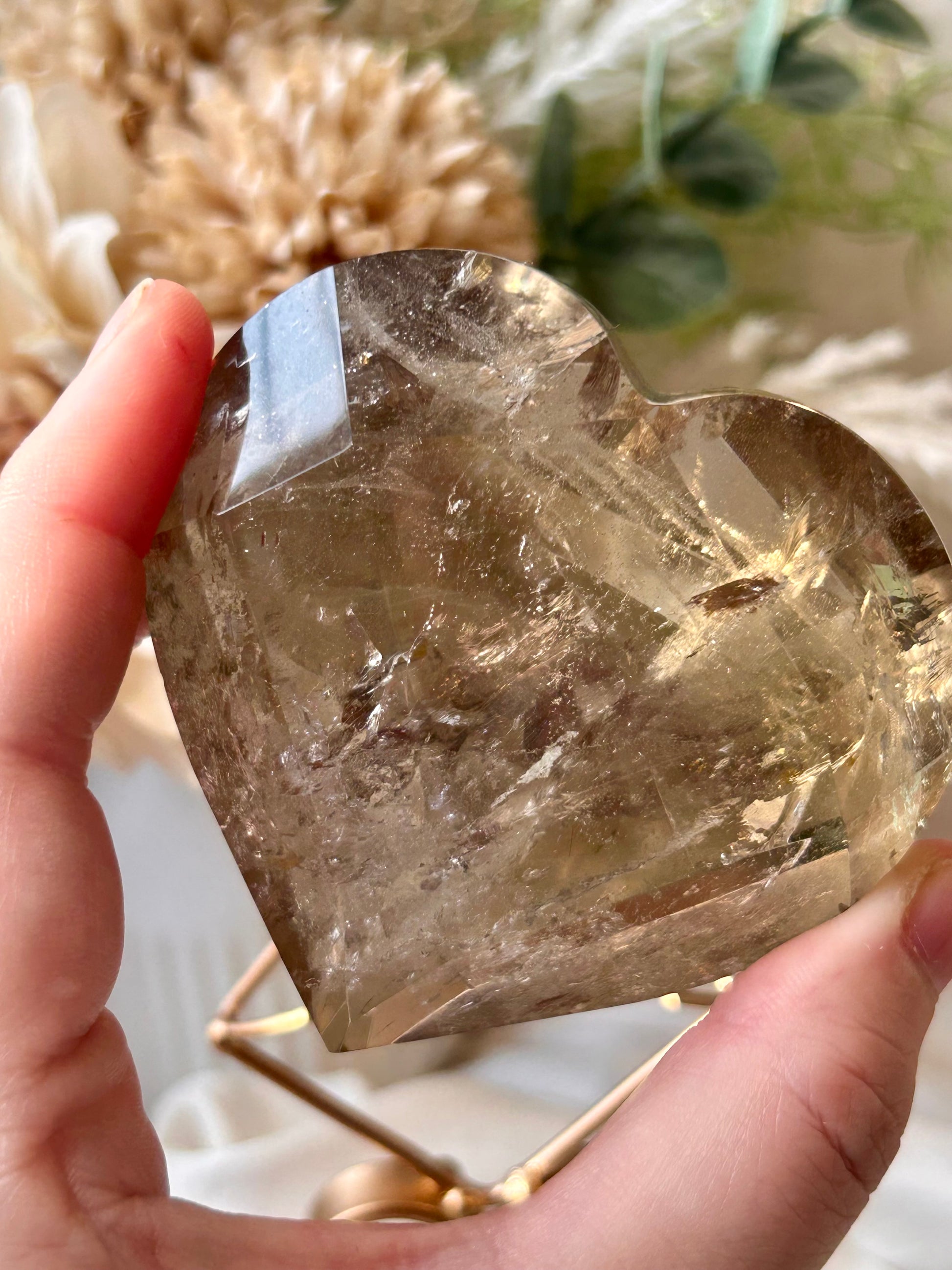 Faceted Smoky Quartz heart with natural smoky tones and custom crystal display stand.