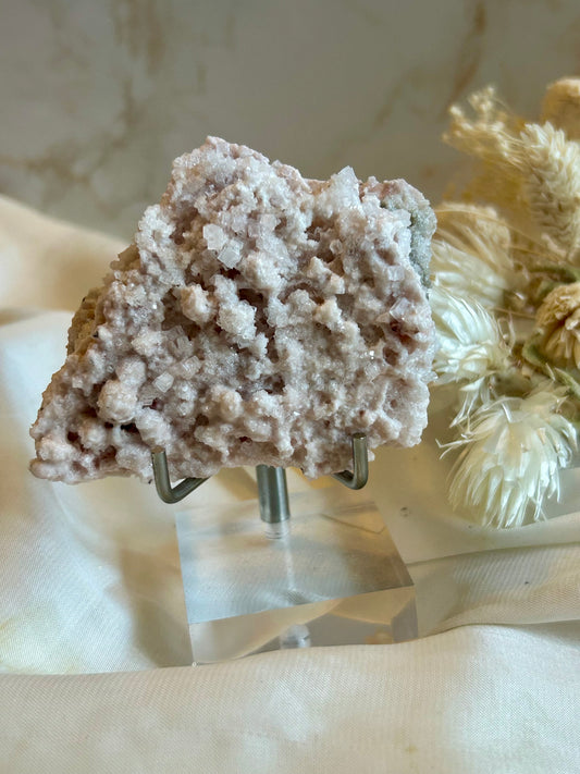 Natural Pink Halite crystal specimen with soft pink tones and delicate mineral formation