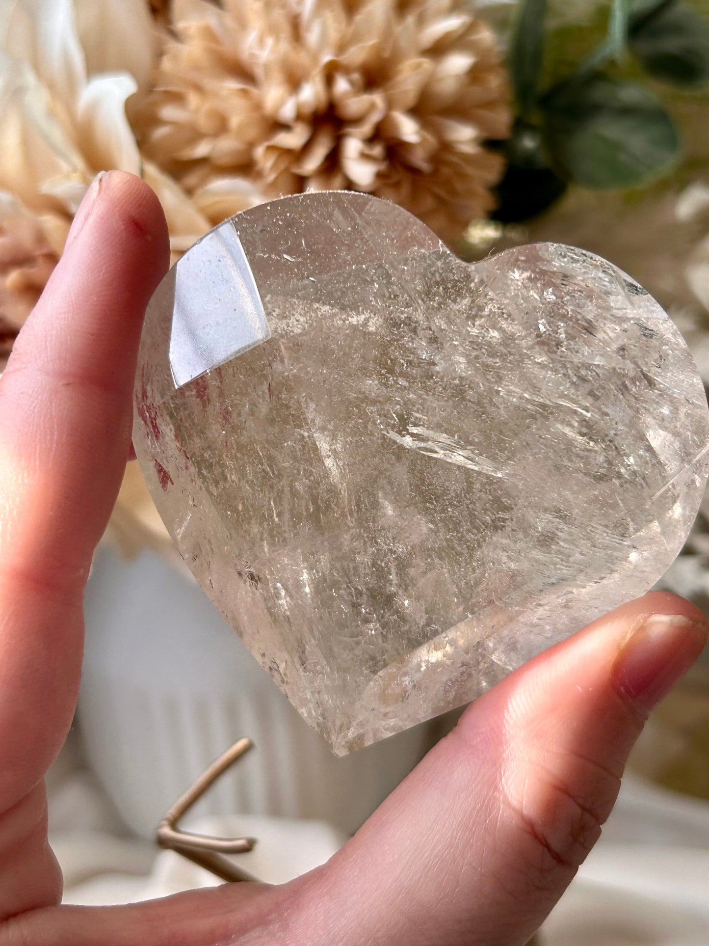 Faceted Smoky Quartz heart with natural smoky tones and custom crystal display stand.