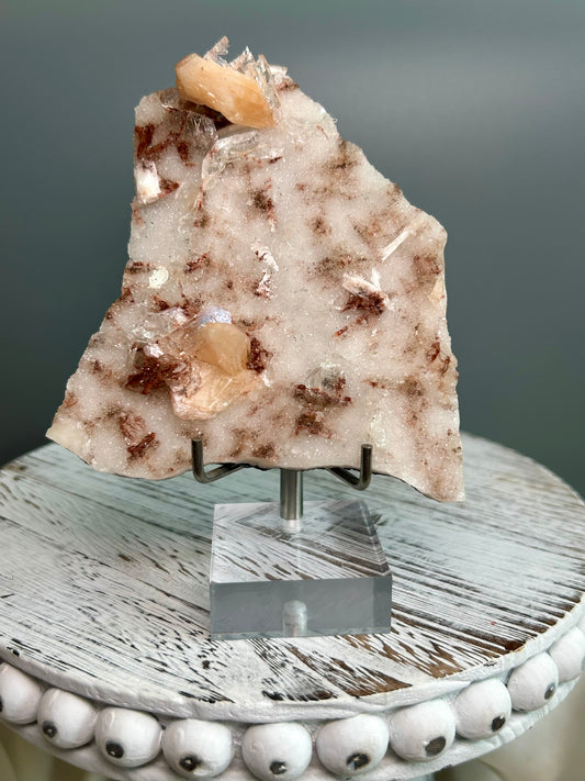 Apophyllite and Stilbite mineral specimen on matrix from Sangamner India, peach stilbite crystals and clear apophyllite cluster on acrylic stand.