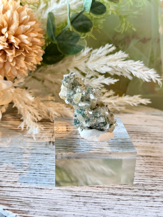 Alien Heulandite mineral specimen featuring intricate translucent crystal clusters, silvery-blue tones, and natural crystalline growth.