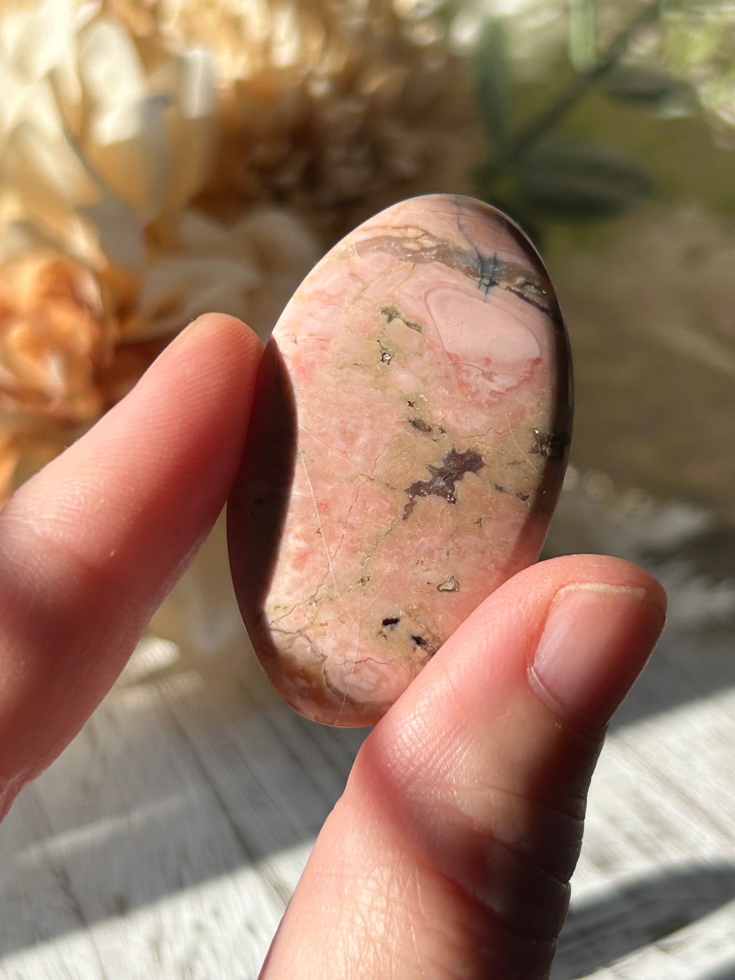 Pink Australian Opal palm stone with soft blush tones, polished finish, and natural patterns.