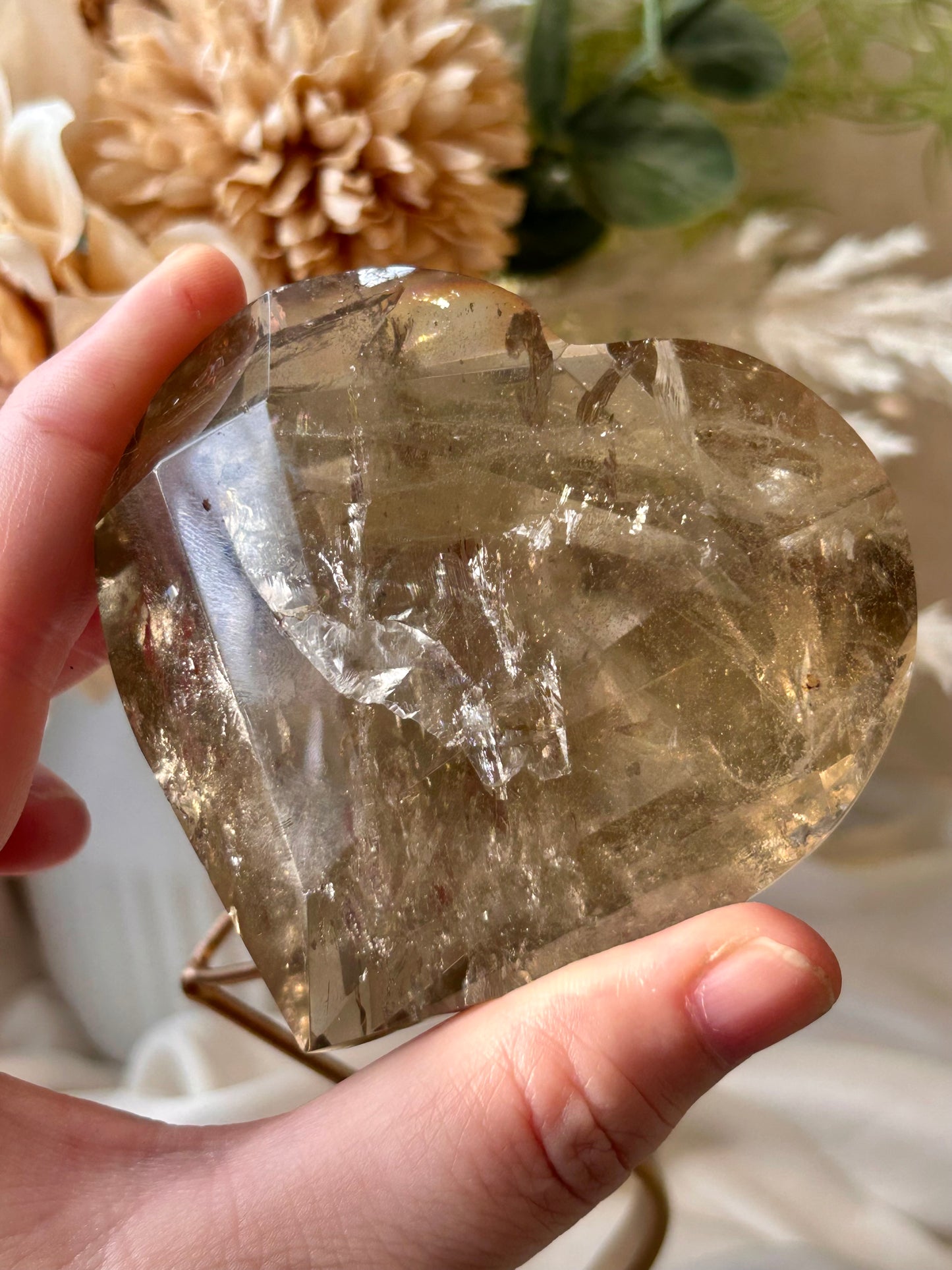 Faceted Smoky Quartz heart with natural smoky tones and custom crystal display stand.