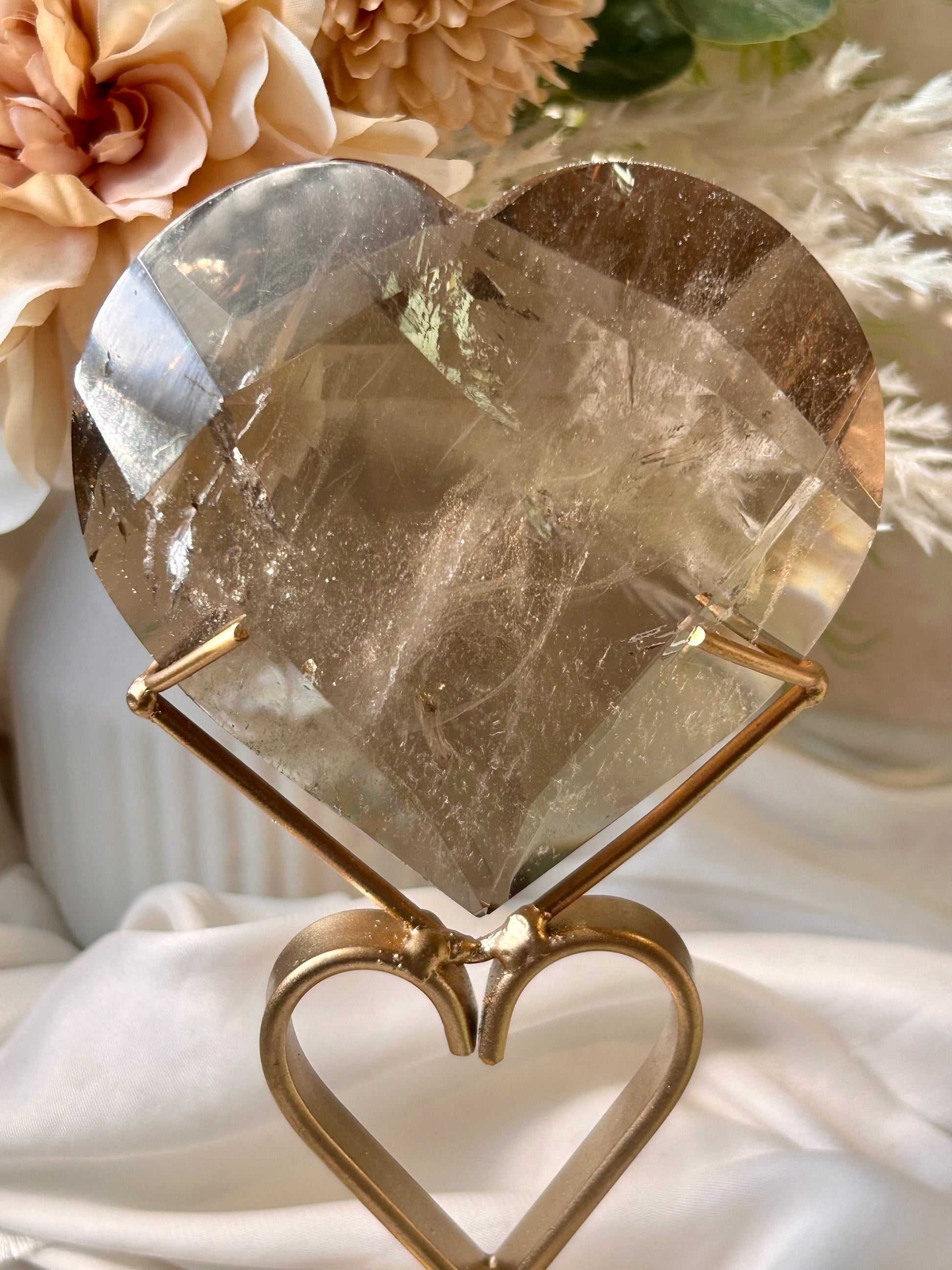 Faceted Smoky Quartz heart with natural smoky tones and custom crystal display stand.