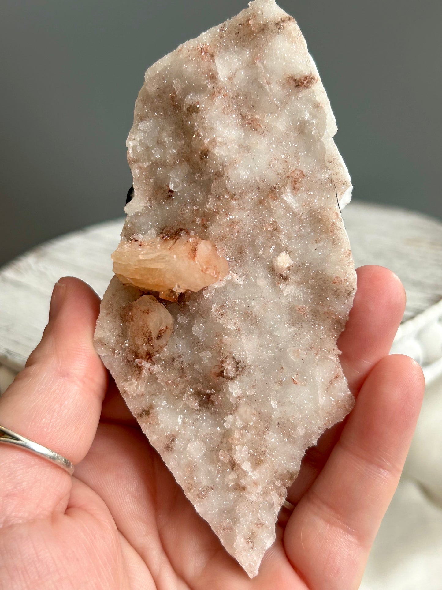 Clear apophyllite stalactite cluster on display, sparkling crystal formation